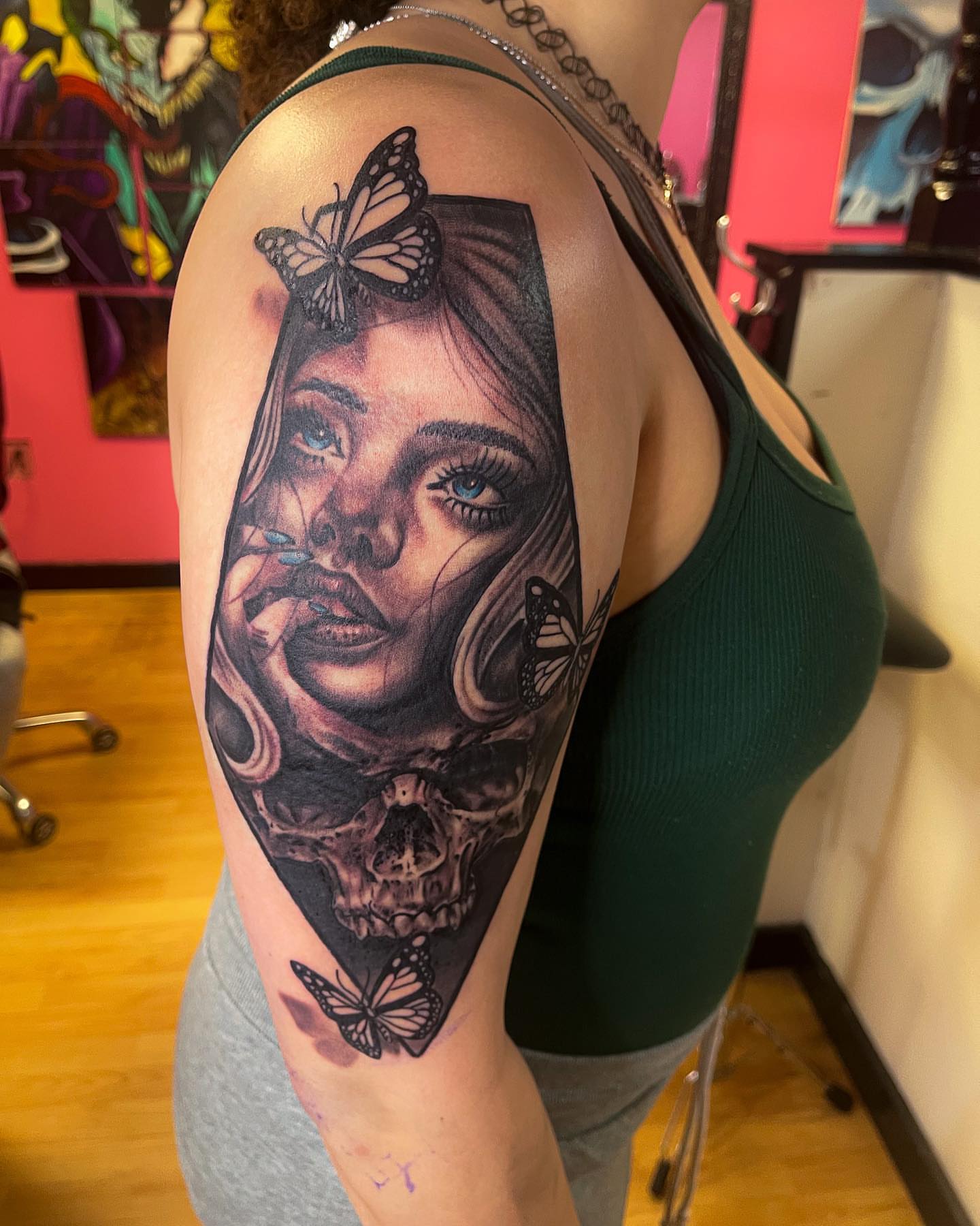 Woman with skull realism tattoo on the shoulder by Ride The Needle Tattoos, New Britain, Connecticut