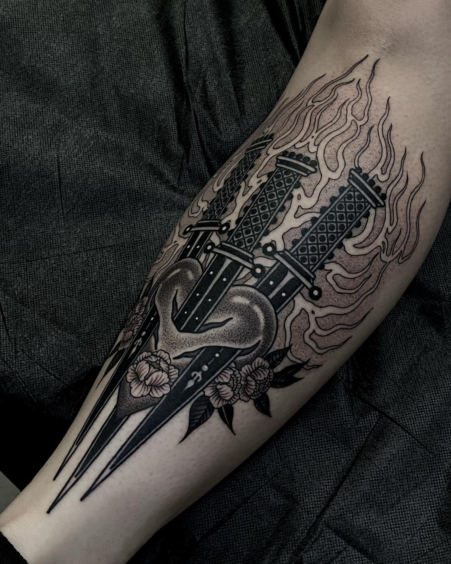 Cross and anchor American traditional tattoo on the forearm by Tyler Charles