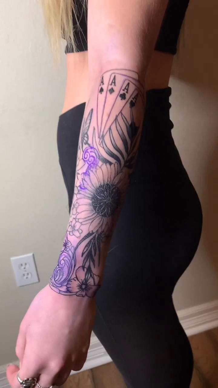 Flowers and playing cards neo-traditional tattoo by Leo Torres
