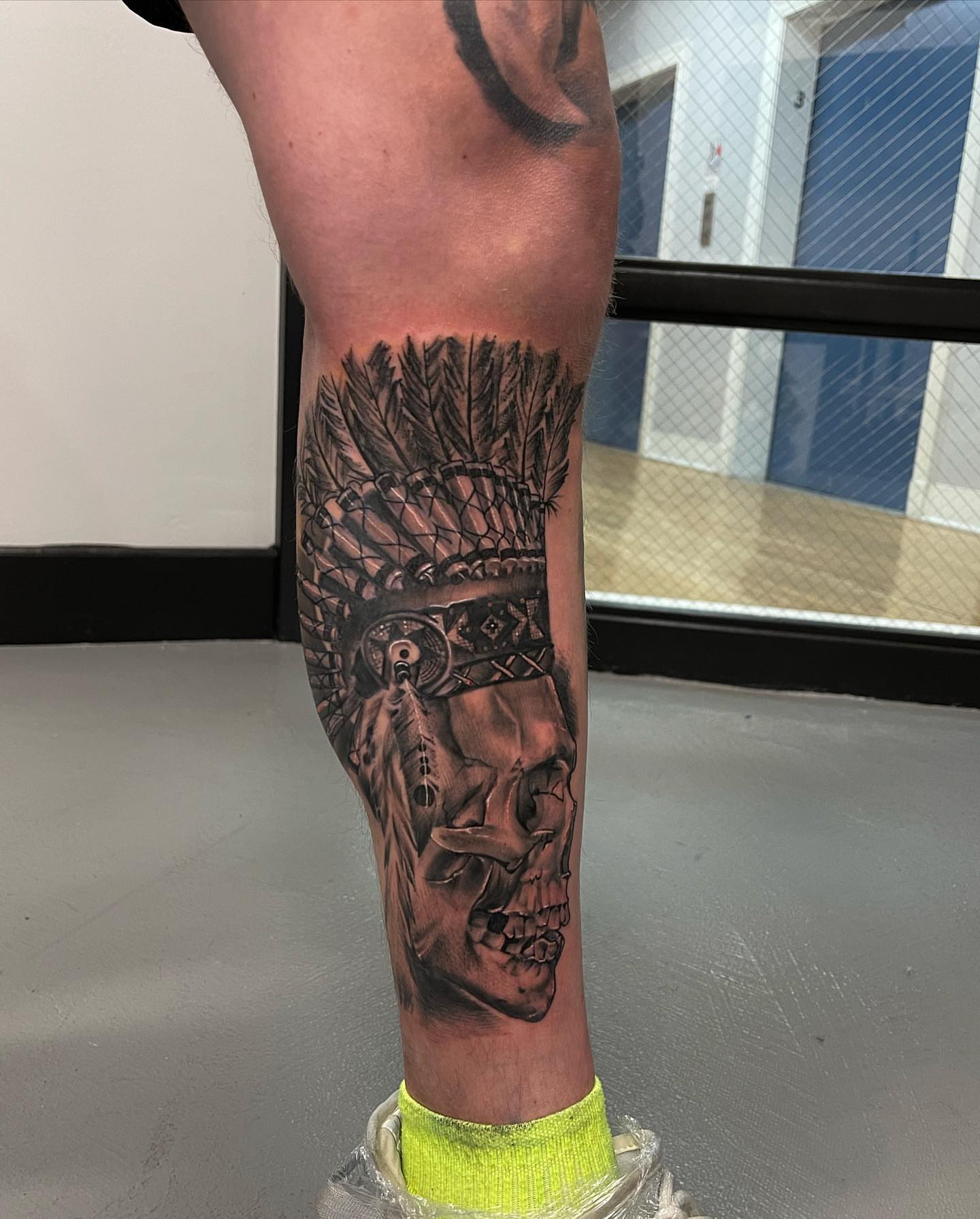 Skull with headdress realism tattoo on the calf by Mikeyftsk2