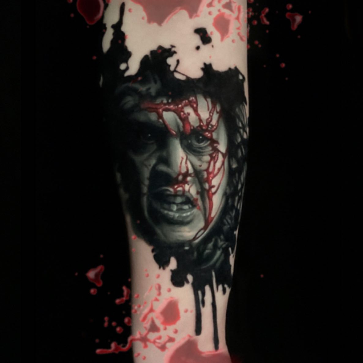 Horror face dark realism tattoo on the forearm by Joshua L Wilson, Dayton, Ohio