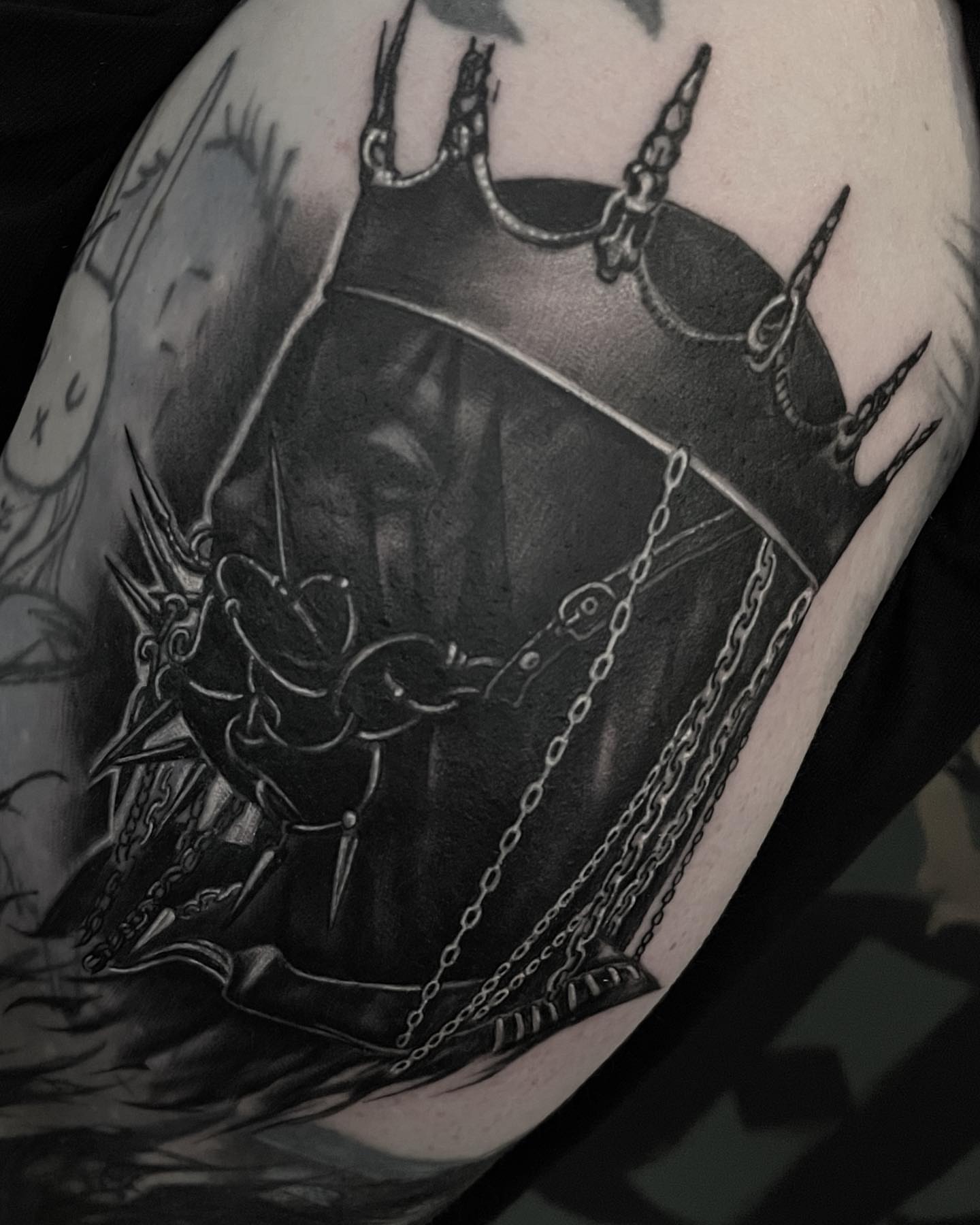 Chainmail crown dark realism tattoo on the forearm by mike hudson