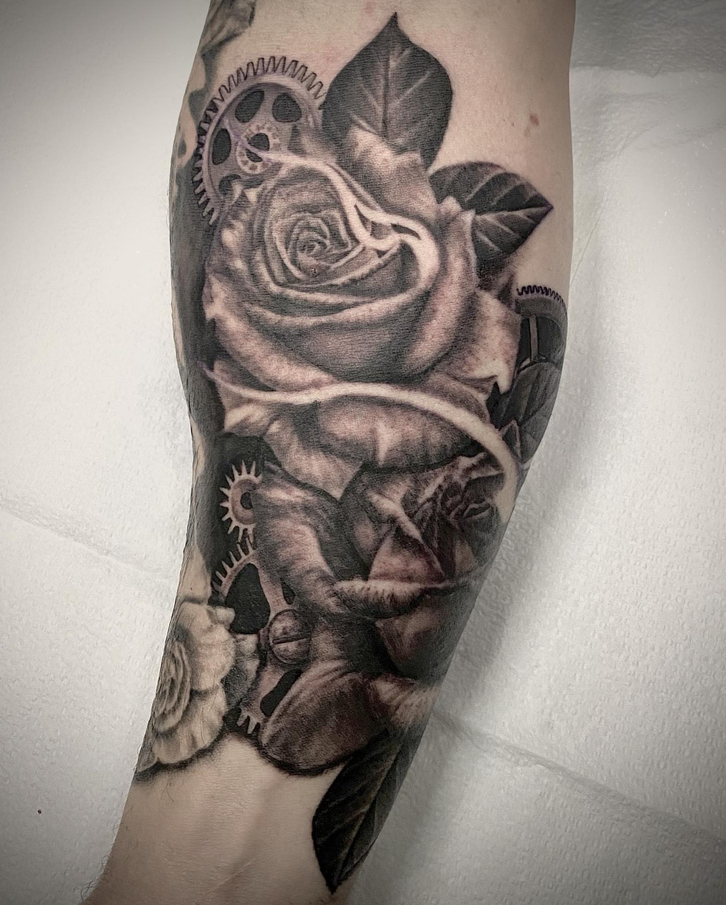 Rose realism tattoo on the forearm by Douglas