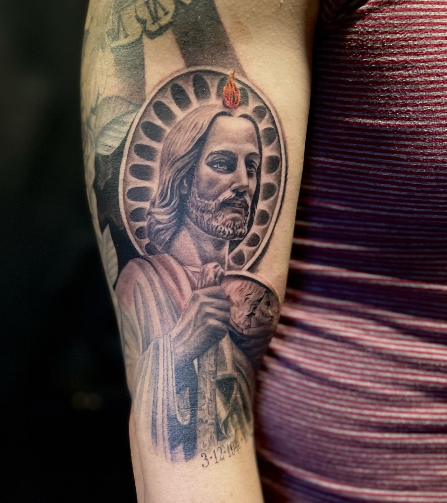 Religious figure realism tattoo on the forearm by JT Ink