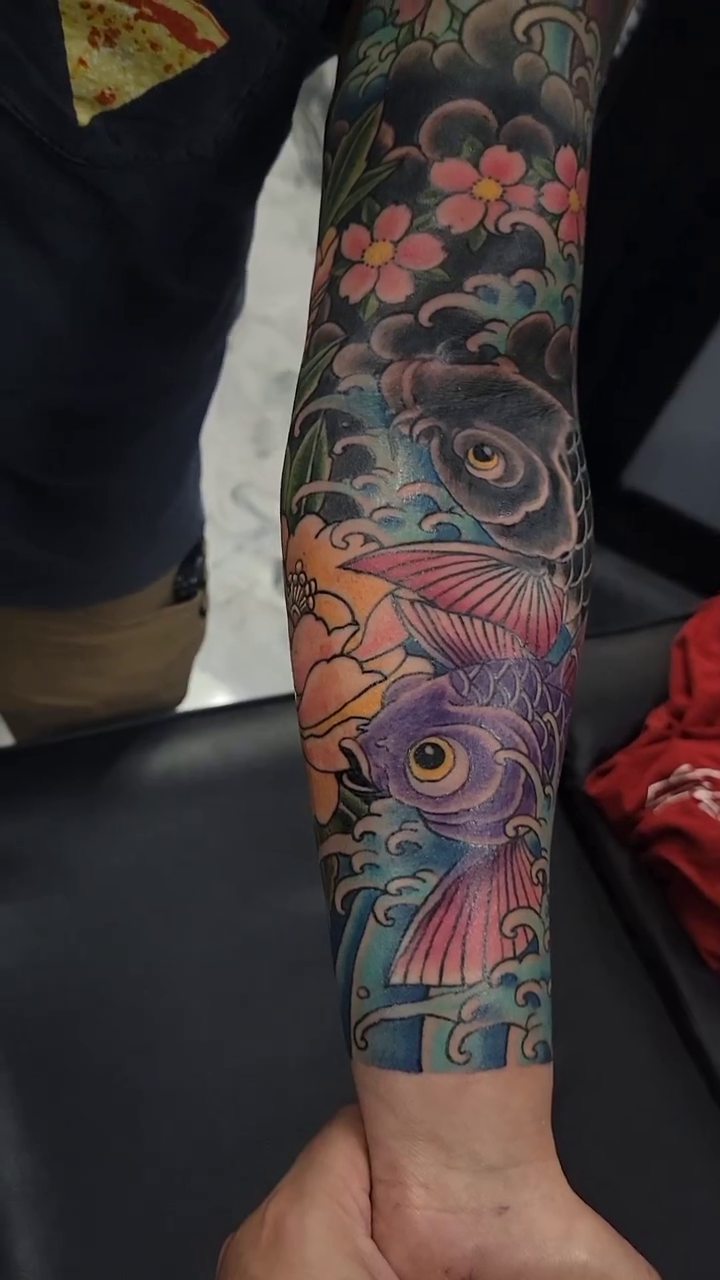 Koi fish and flowers japanese irezumi tattoo by James Vaughn