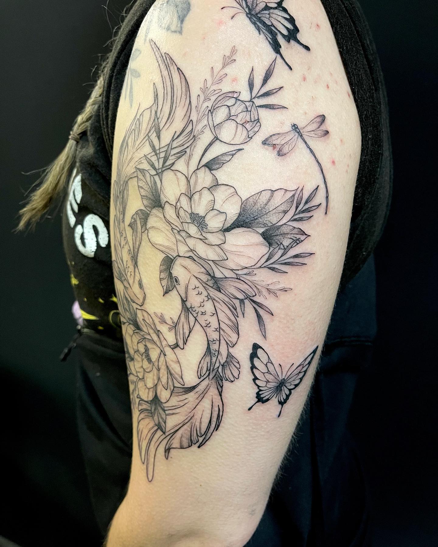 Floral bouquet realism tattoo on the forearm by Lexx Christine