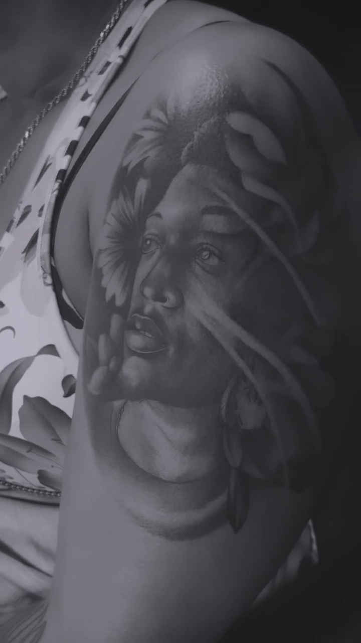 Woman with snake realism tattoo by Anwon Johnson