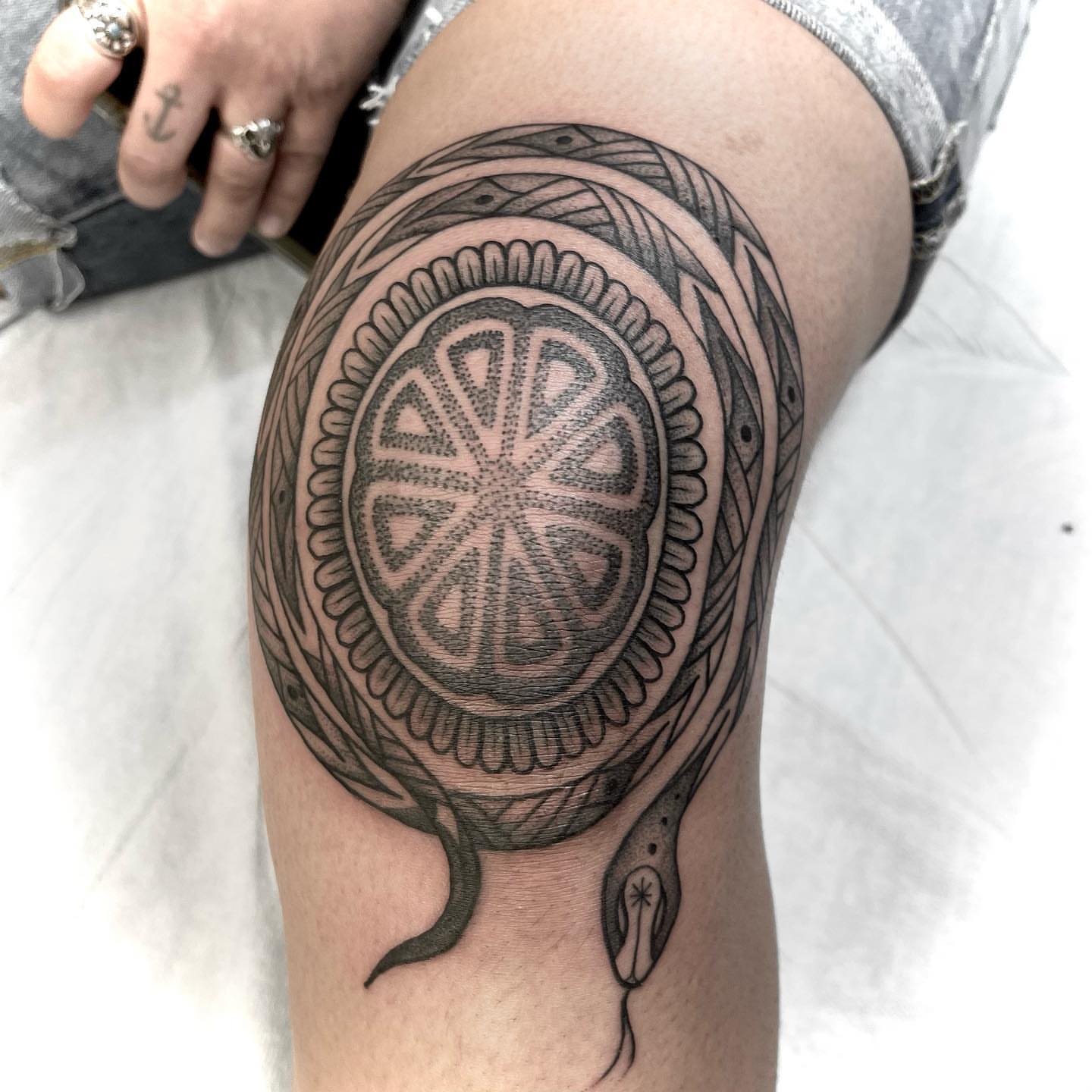 Geometric mandala dotwork tattoo on the thigh by Jason Ryan