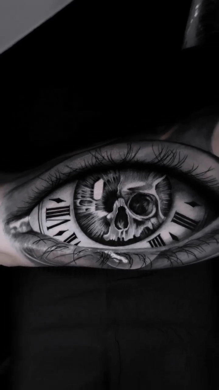 Eye with skull and clock realism tattoo by Luis Bravo