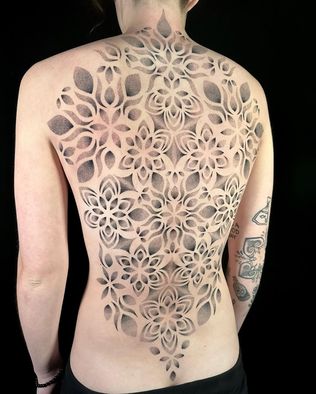 Geometric mandala pattern dotwork tattoo on the back by Chelsey
