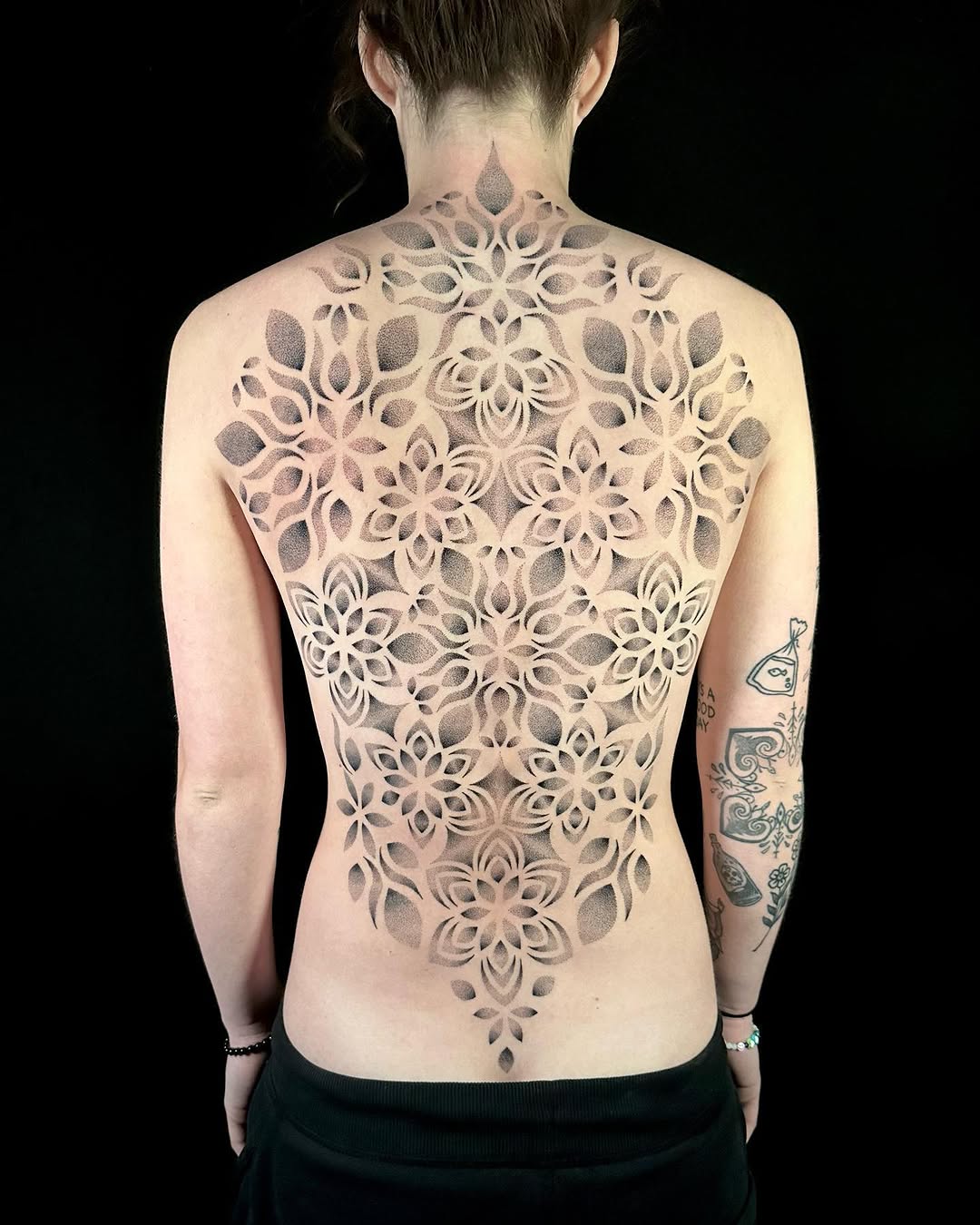 Geometric mandala pattern geometric tattoo on the back by Chelsey