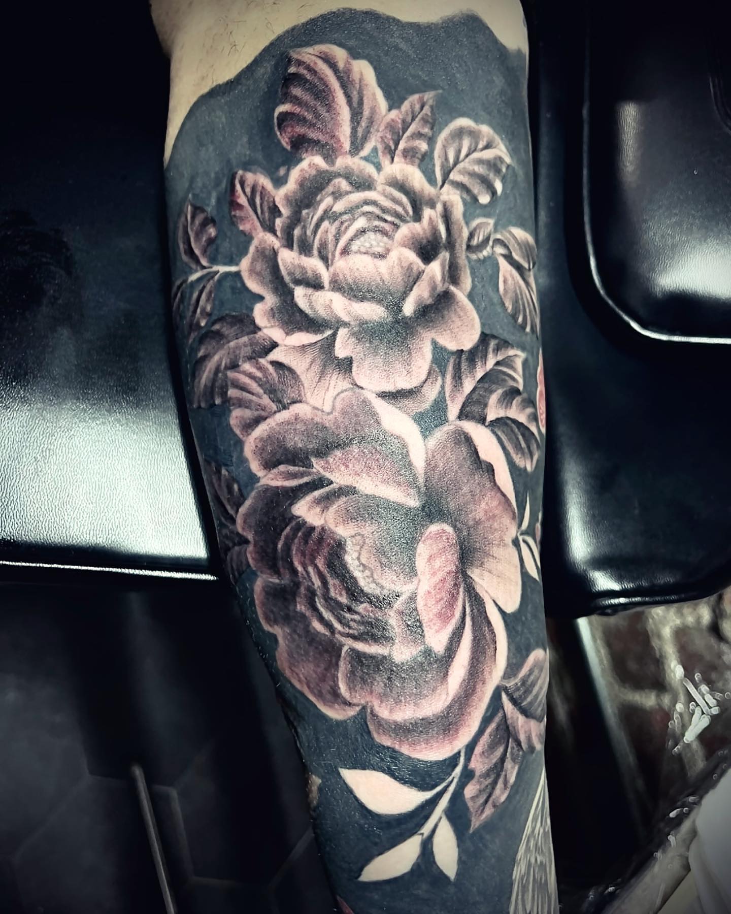 Peony flowers realism tattoo on the forearm by Peewee Morales