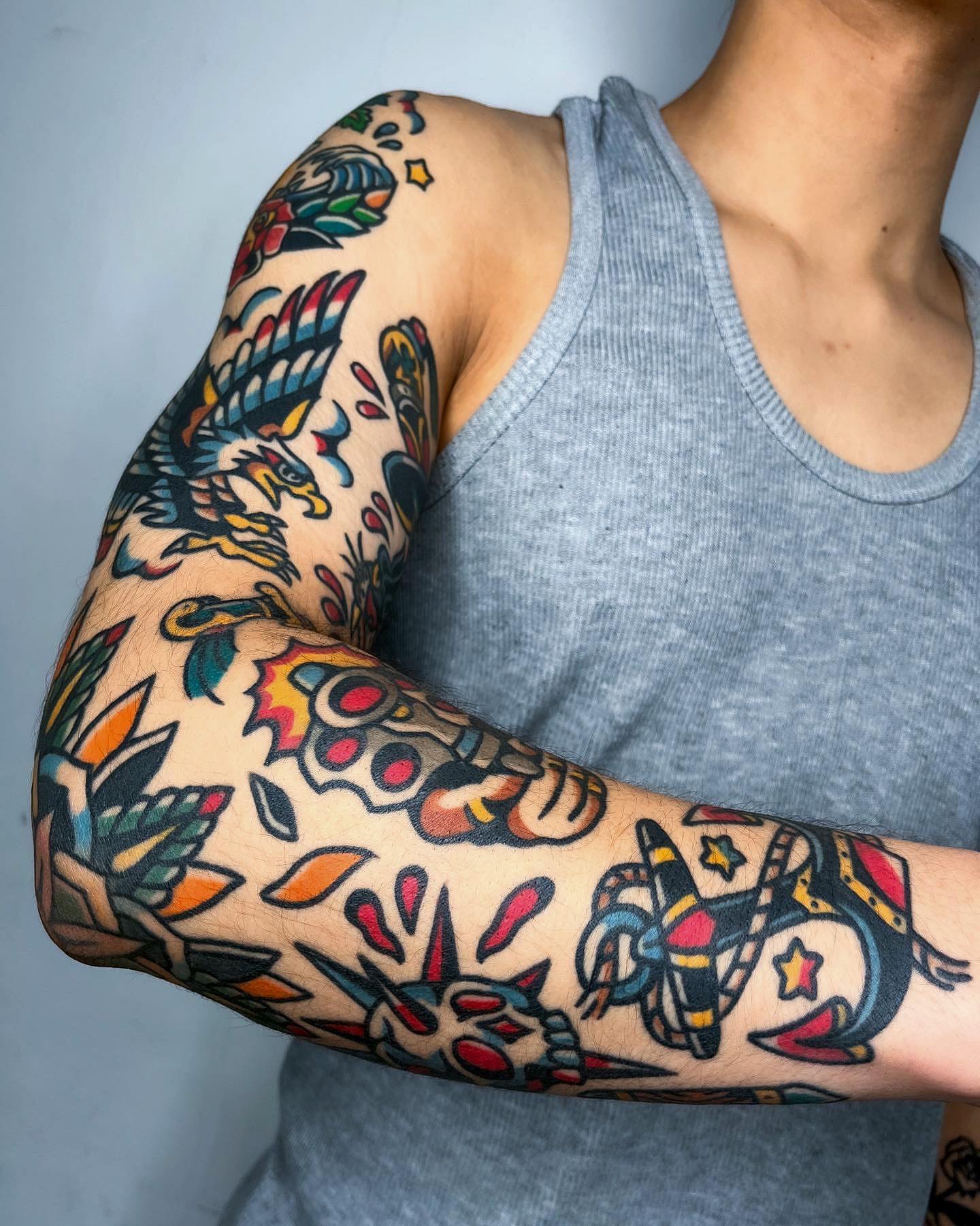 Floral and bird American traditional tattoo on the forearm by Oldschool Tattooer Takii 타키