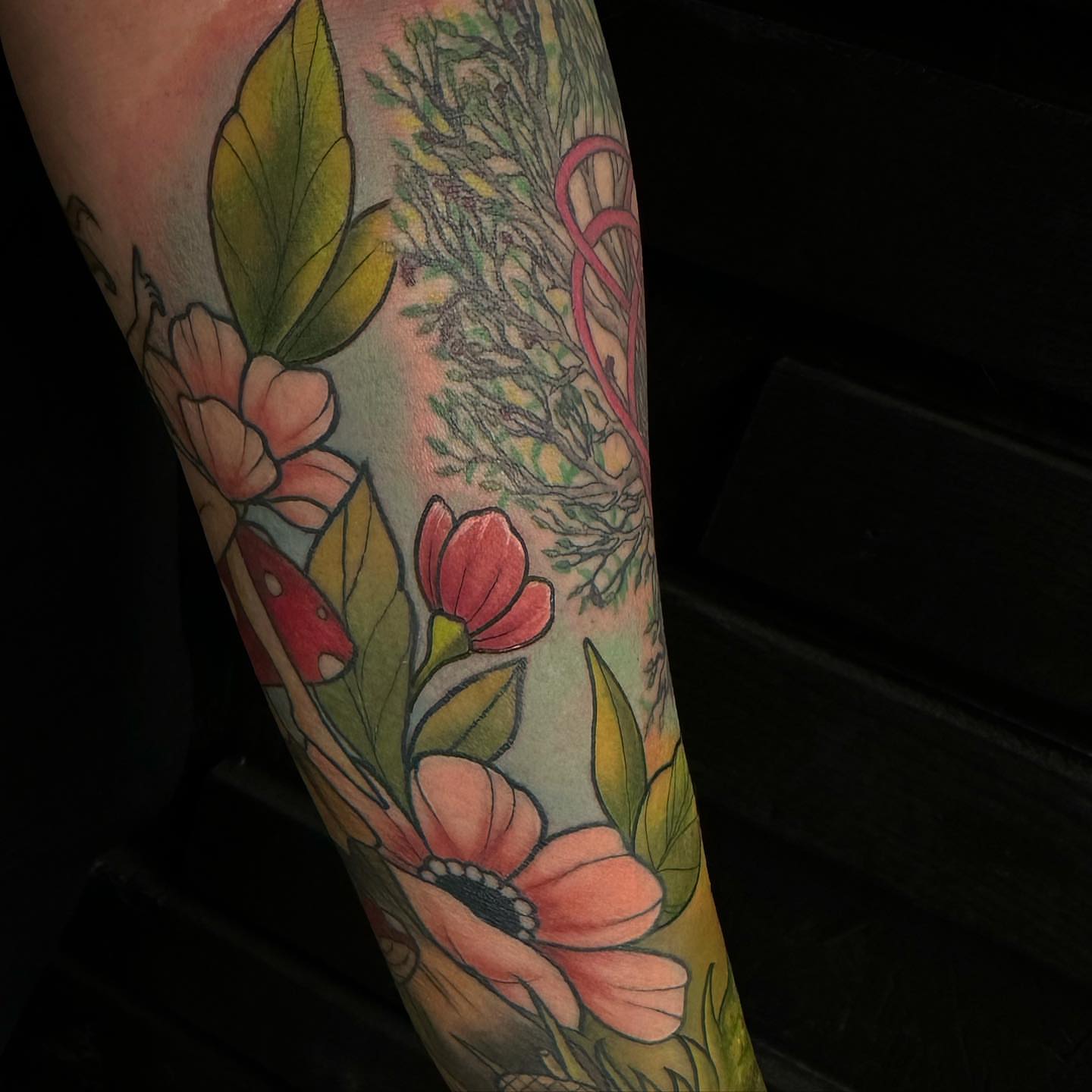 Flowers and leaves American traditional tattoo on the forearm by audi