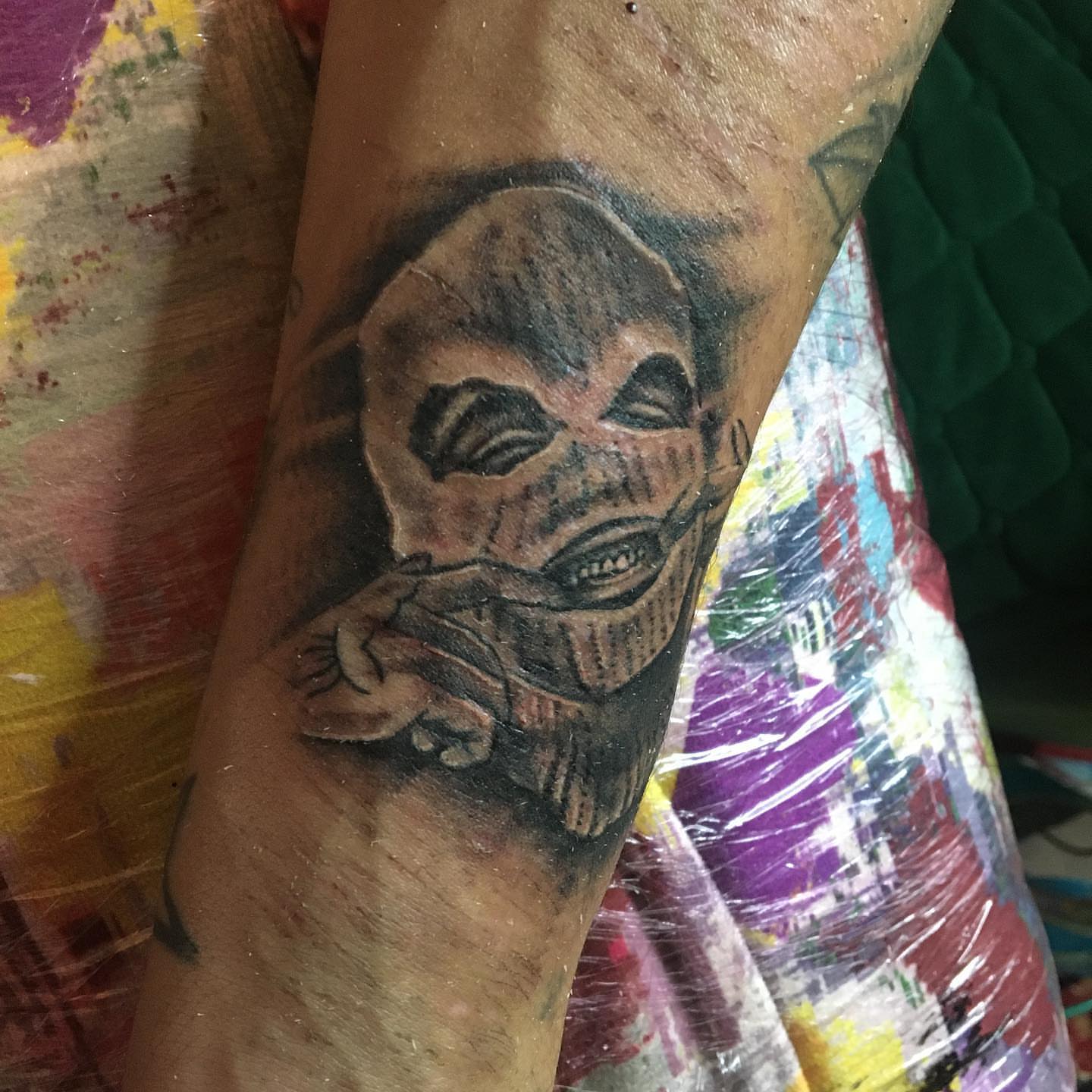 Grinning human skull realism tattoo on the forearm by la flamme