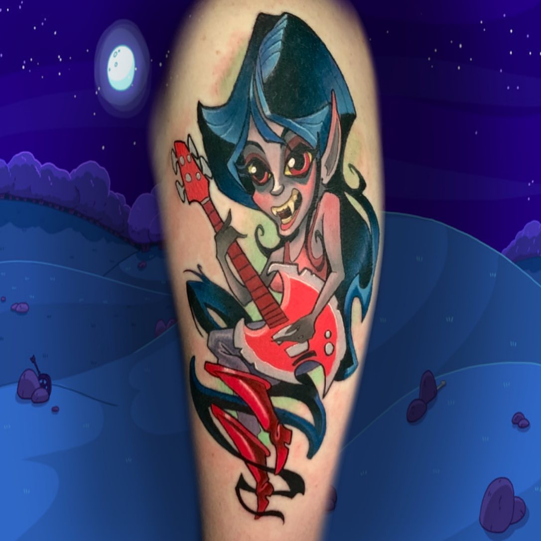 Vampire playing guitar anime tattoo on the forearm by Joshua L Wilson, Dayton, Ohio