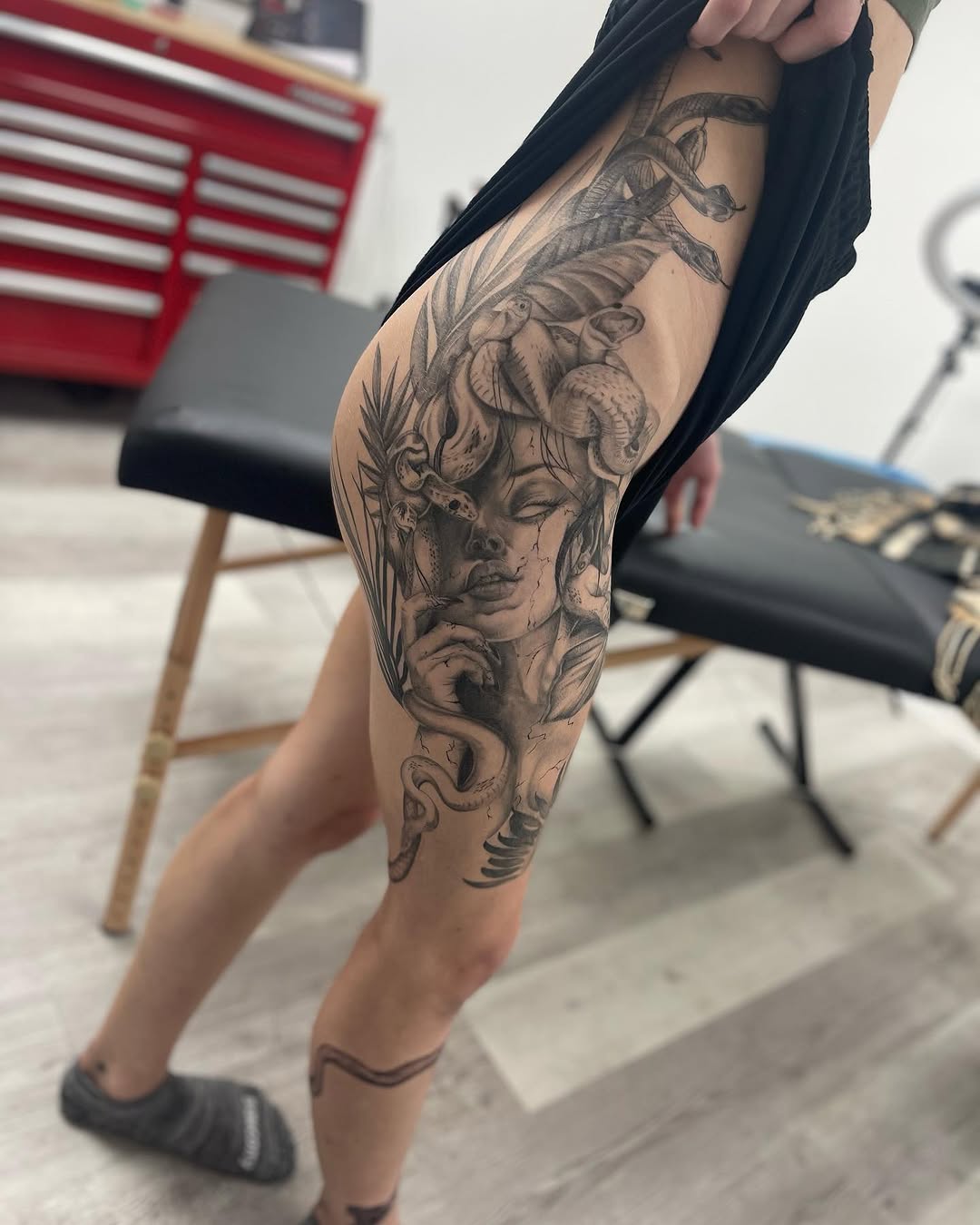 Medusa with snakes realism tattoo on the thigh by Antonio