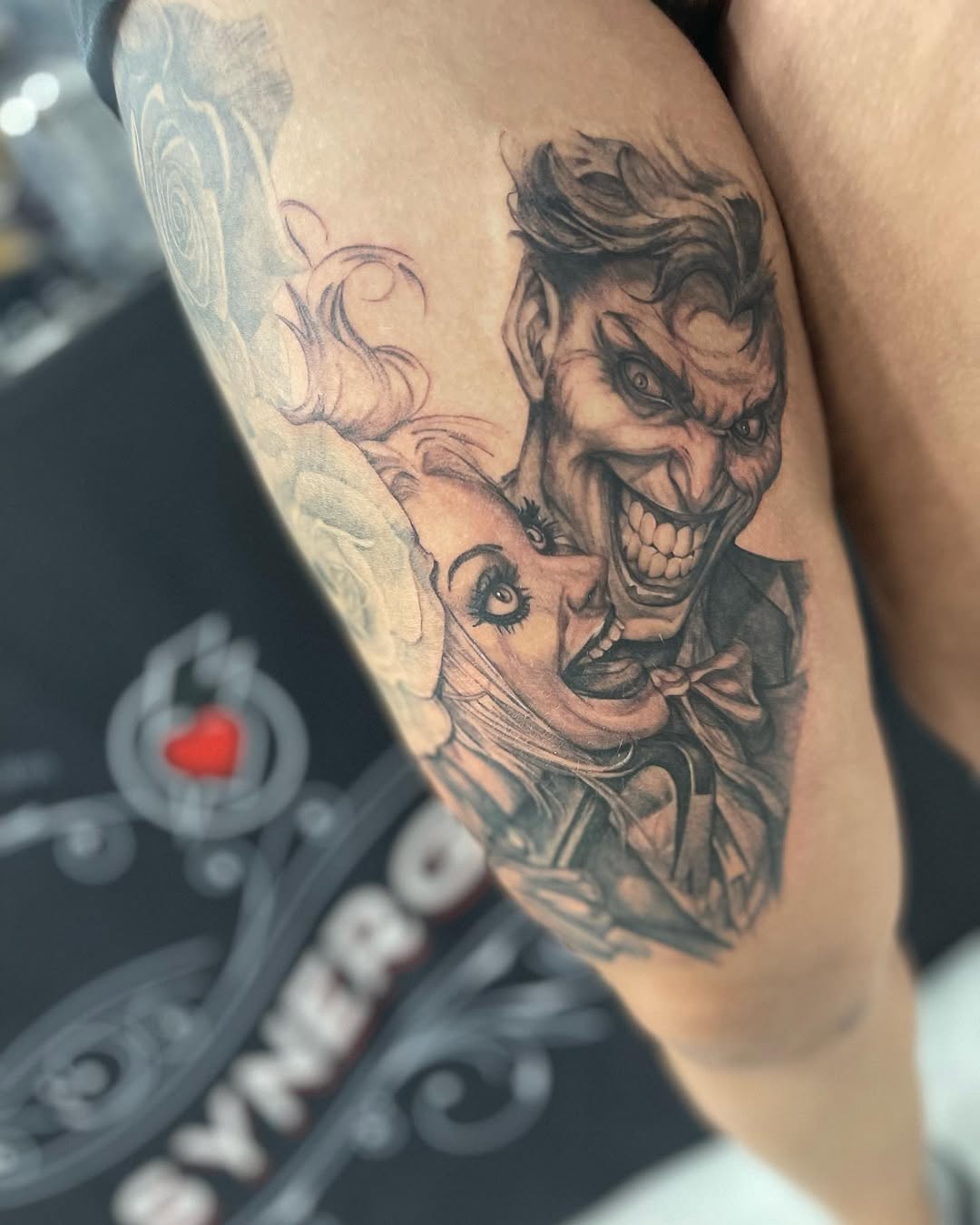 Joker and Harley Quinn tattoo on the forearm by Antonio