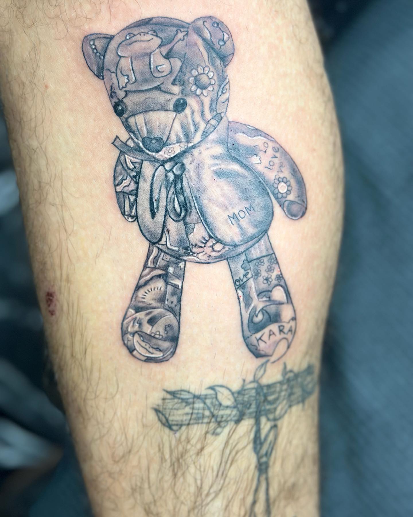 Teddy bear black and grey tattoo on the forearm by Cyko Hernandez