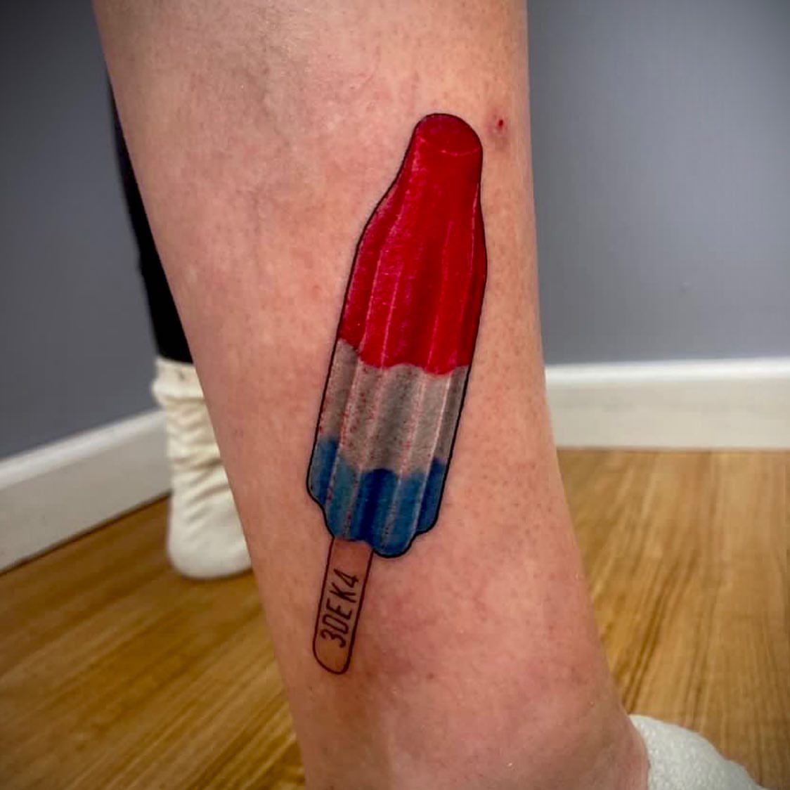 Popsicle realism tattoo on the forearm by MR