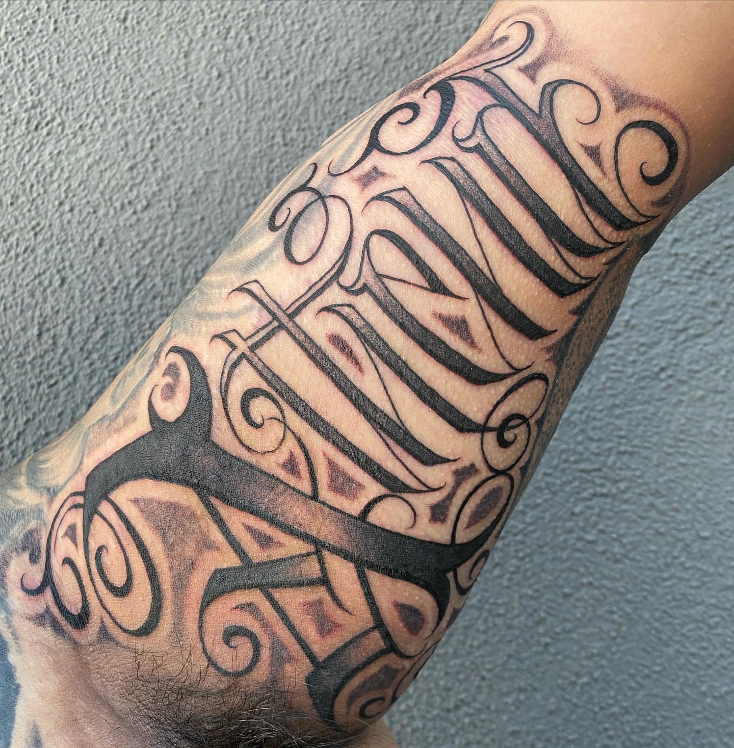 Script lettering lettering script tattoo on the forearm by El Pato, San Jose, California
