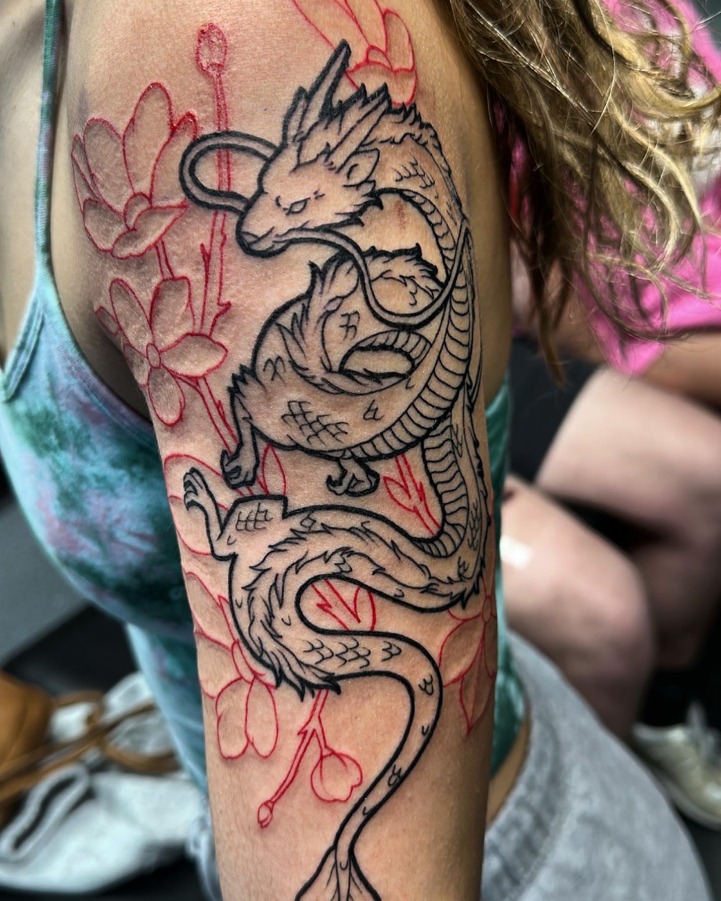 Dragon and cherry blossoms japanese irezumi tattoo on the forearm by Pablo Venegas
