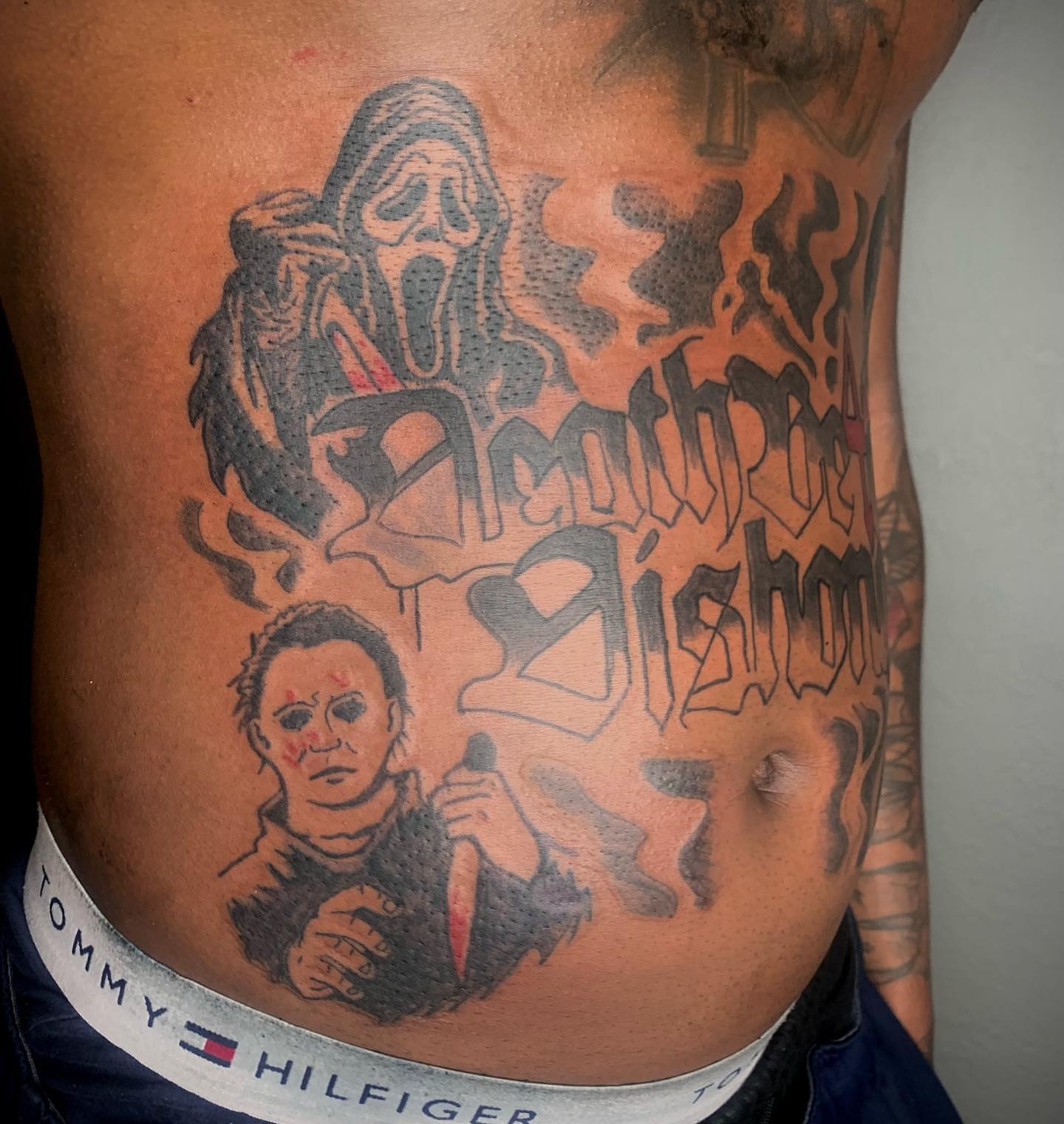 Horror movie characters realism tattoo on the torso by Evan Chastain