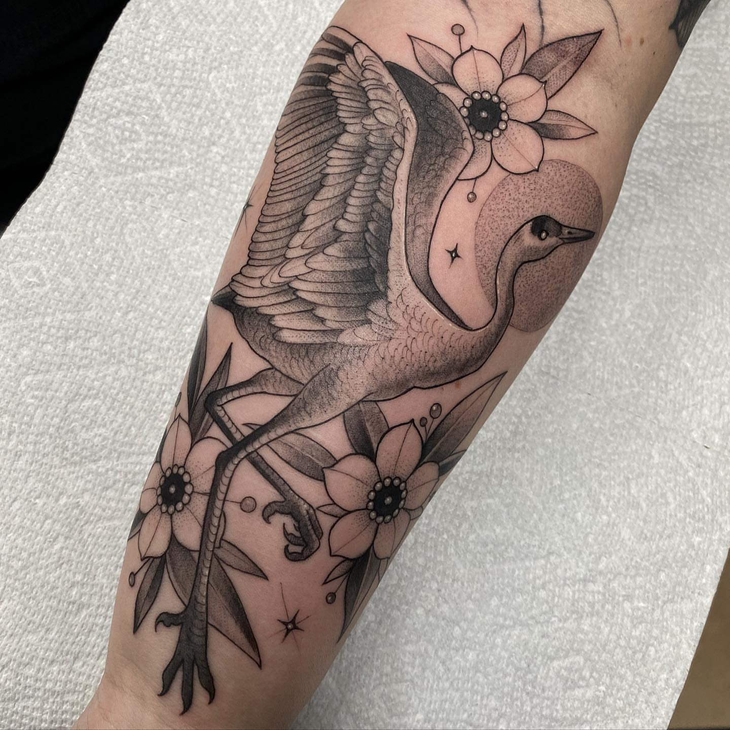 Goose and flowers dotwork tattoo on the forearm by Marissa Tattoos