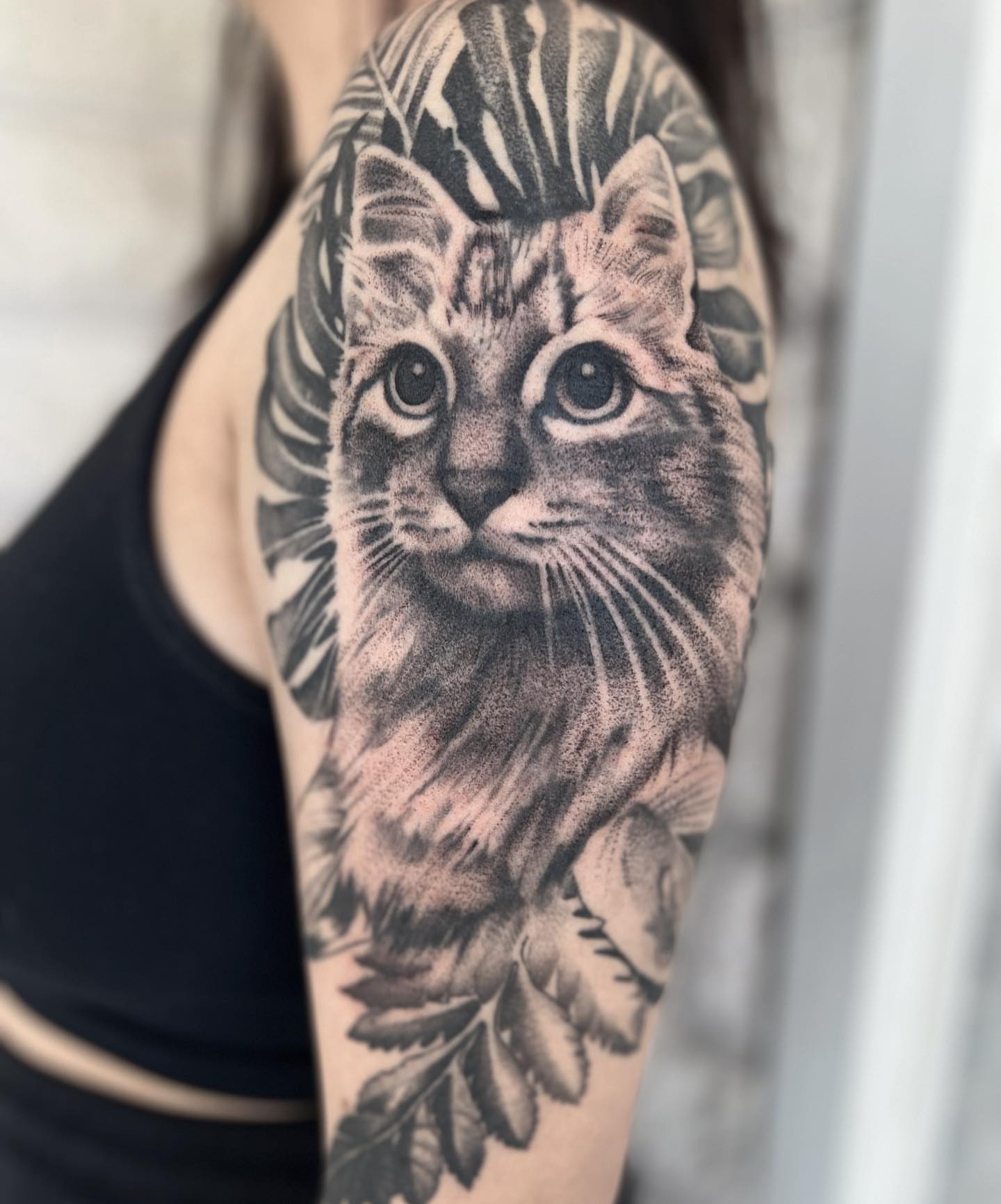 Cat dotwork tattoo on the forearm by Emily Jestine Francis
