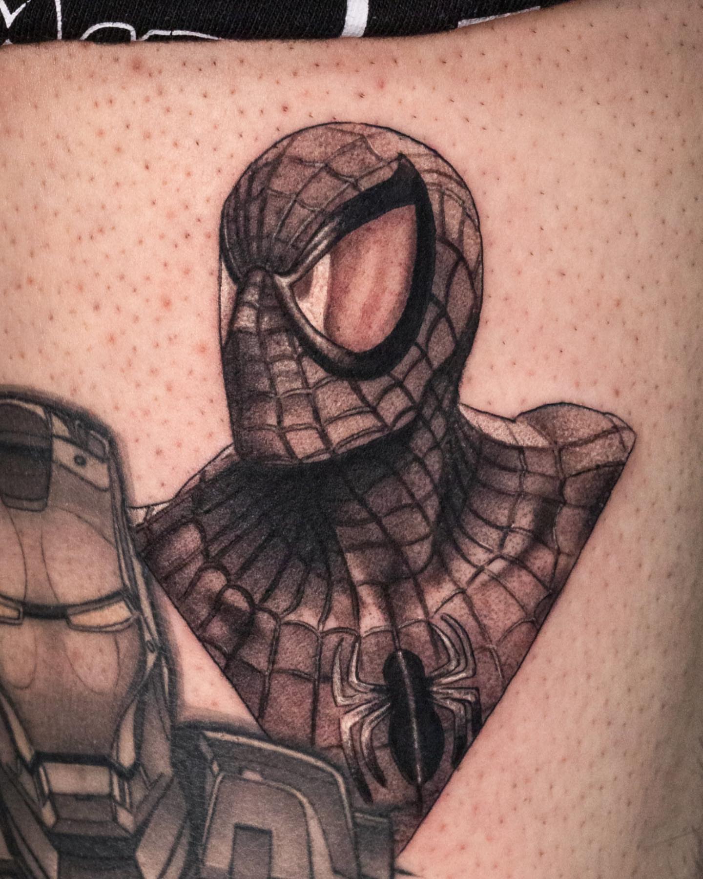 Spiderman black and grey tattoo on the forearm by Jaime Navarro