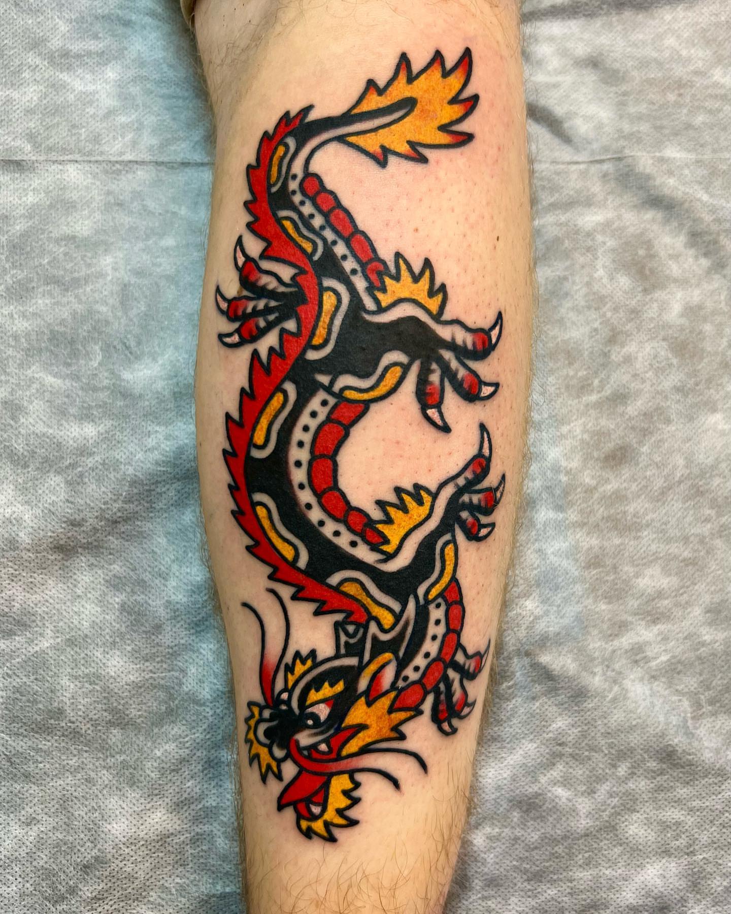 Dragon American traditional tattoo on the forearm by Nicholas Mella, Nashville, Tennessee