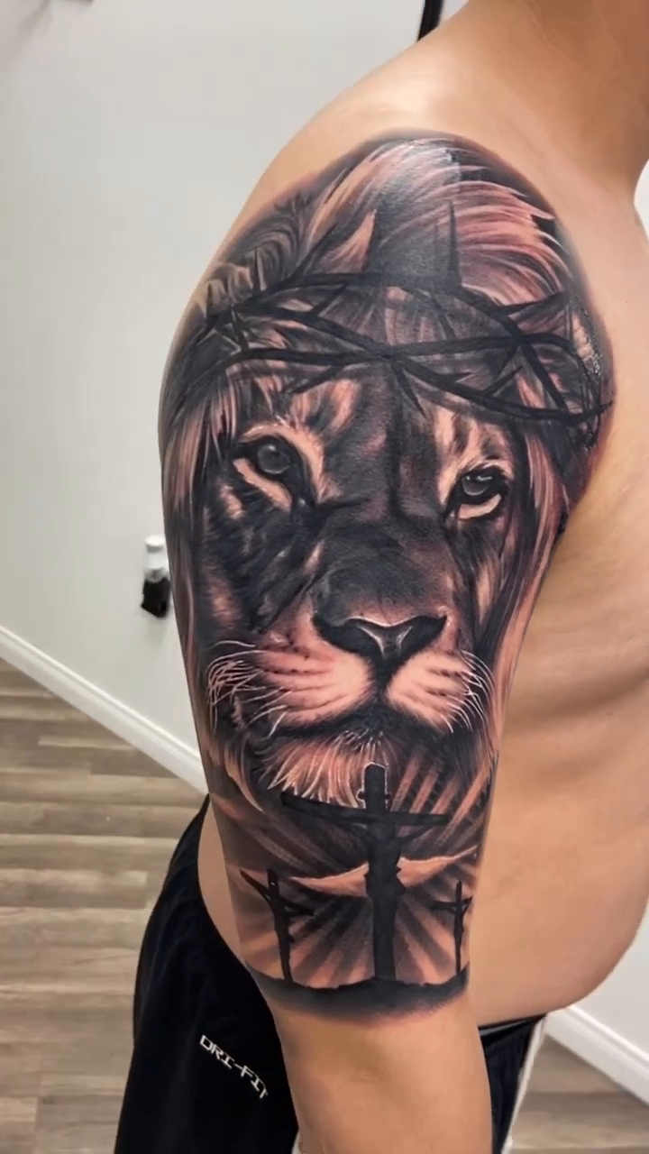 Lion and crown of thorns realism tattoo by Joshua ramirez, Montebello, California