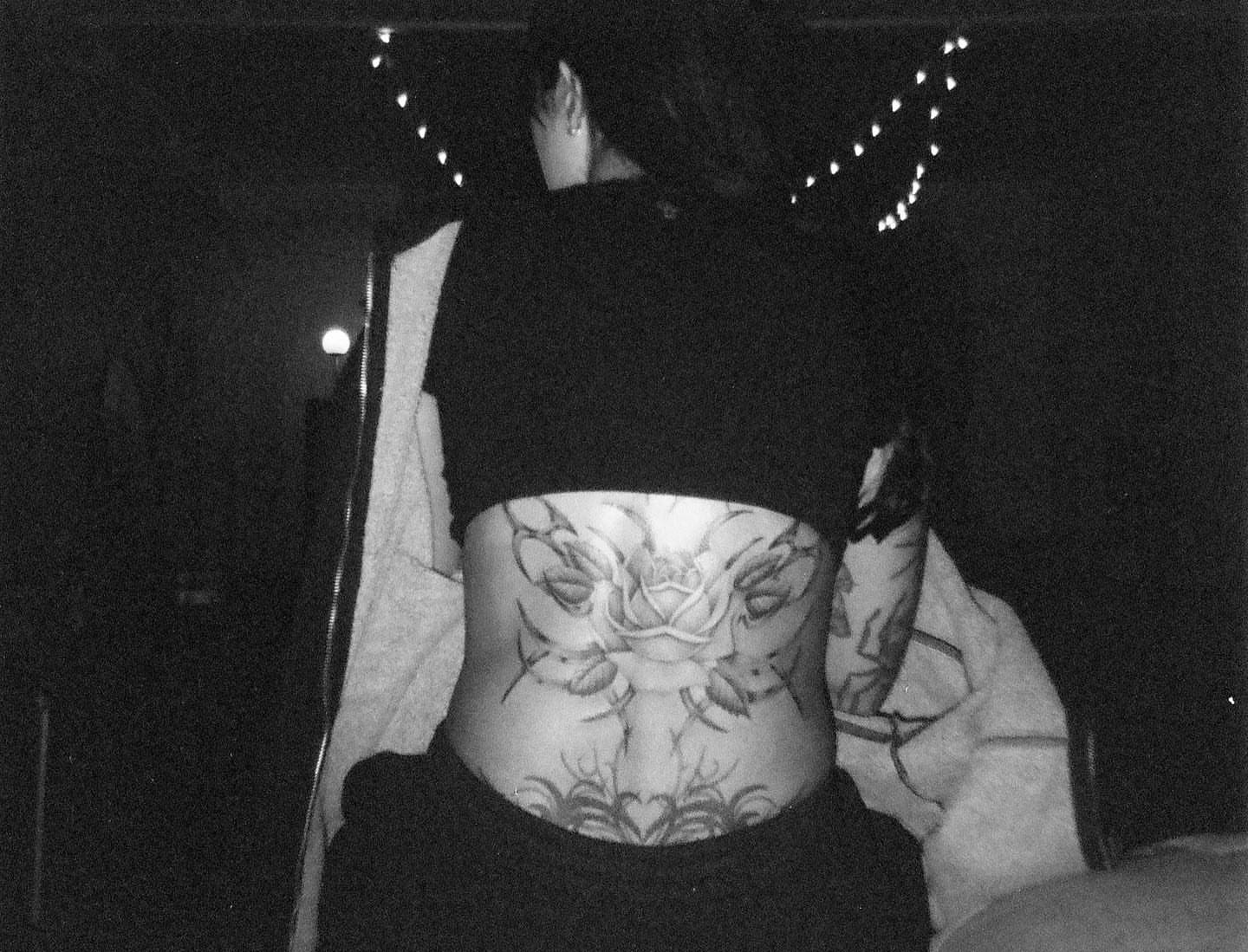 Rose black and grey tattoo on the torso by Chriscalibur