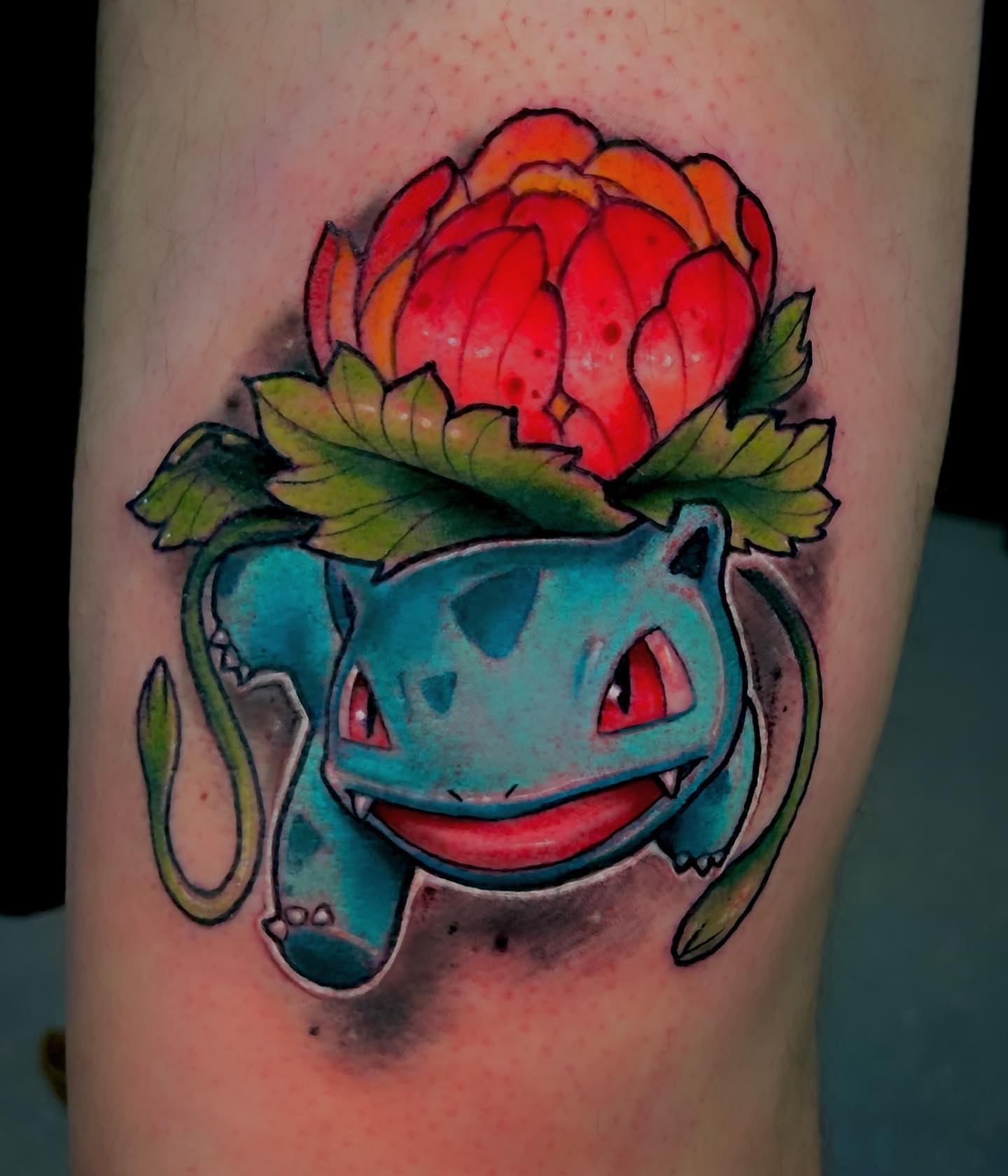 Bulbasaur with flower crown American traditional tattoo on the thigh by Greg West Sac tattoo artist, West Sacramento, California