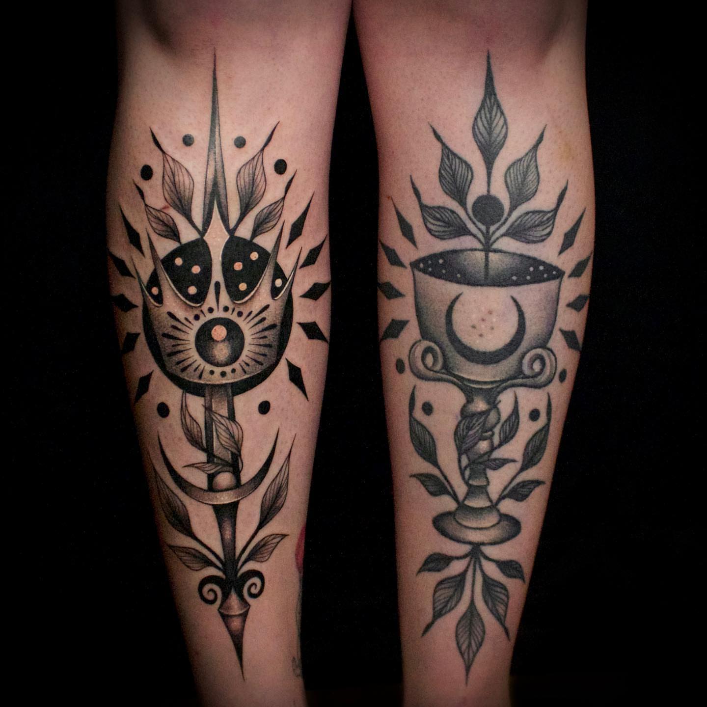 Solar and lunar symbols American traditional tattoo on the forearm by Galen