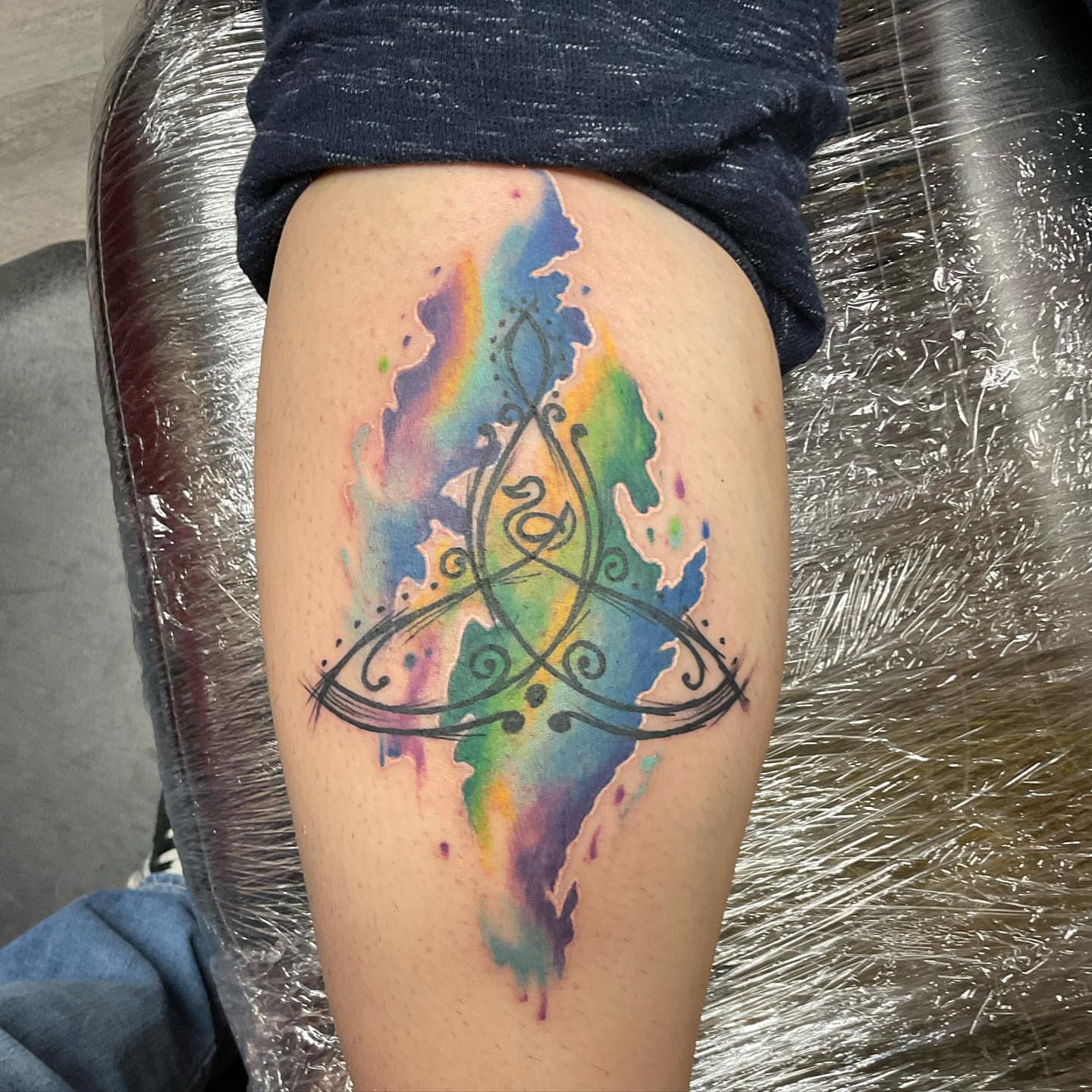 Tattoo by @huckleberrytattoos — watercolor, geometric