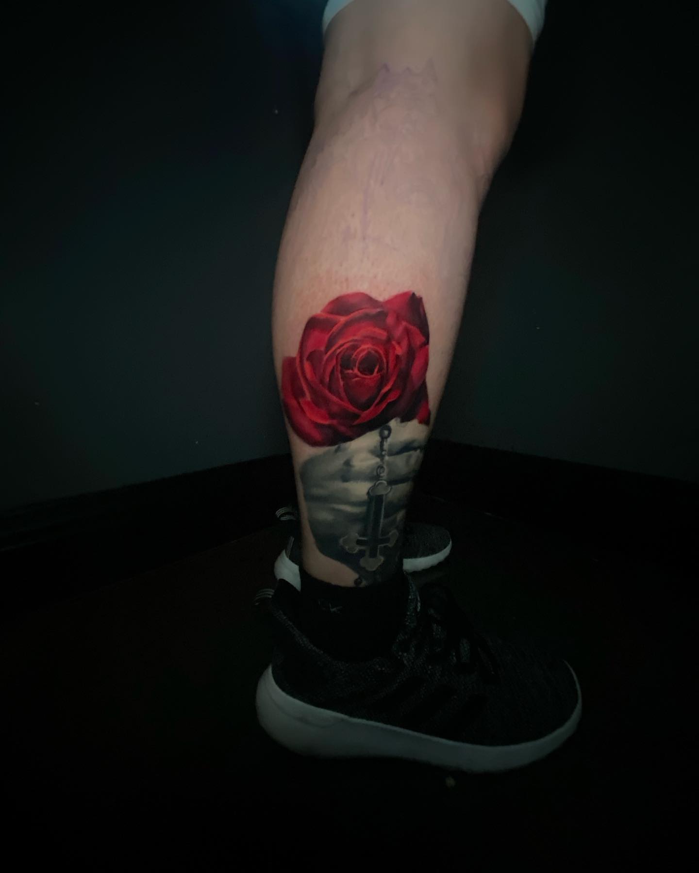 Red rose realism tattoo on the calf by Lindsey Lane, Dallas, Texas