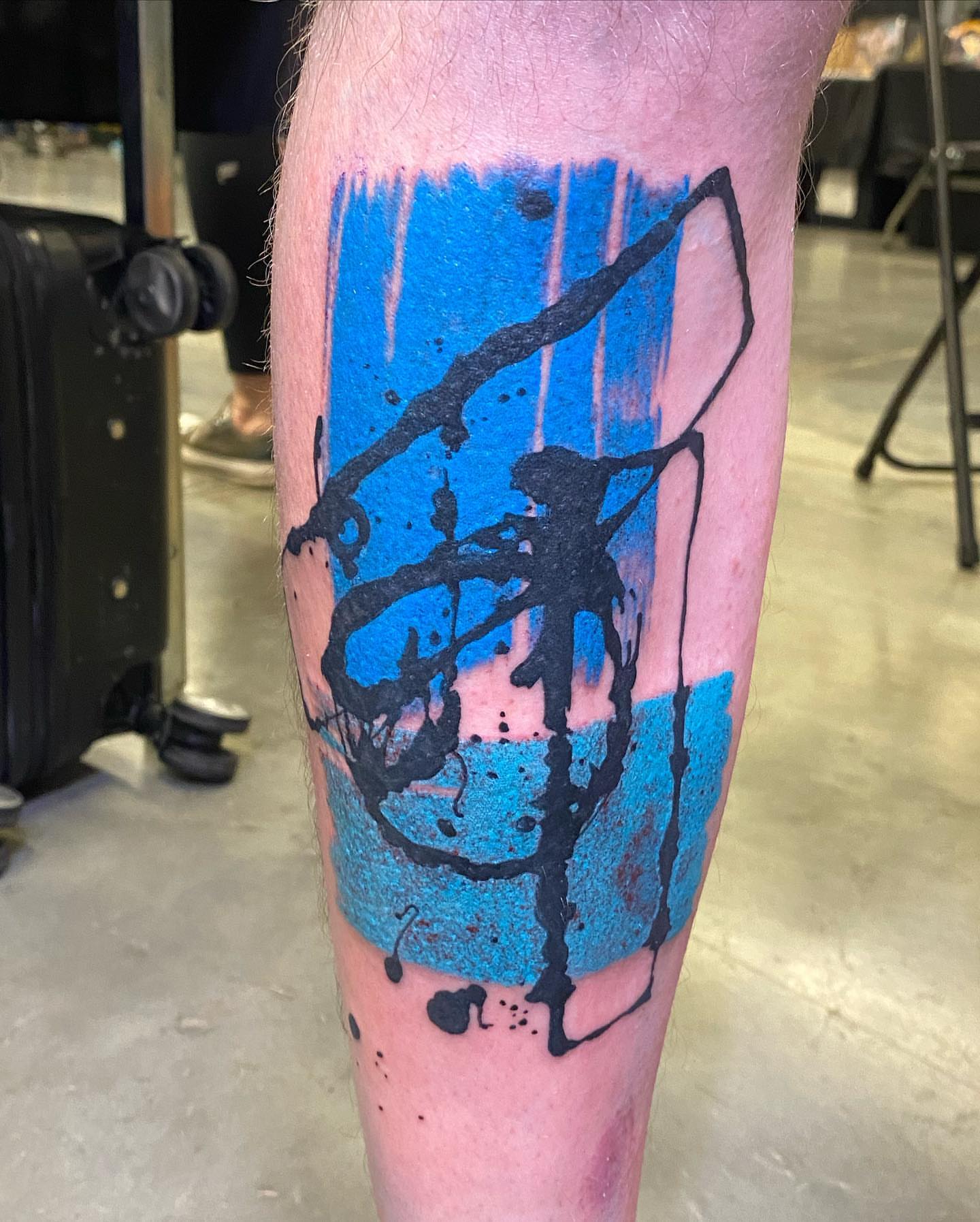 Abstract splatter dotwork tattoo on the forearm by Keith Cromie