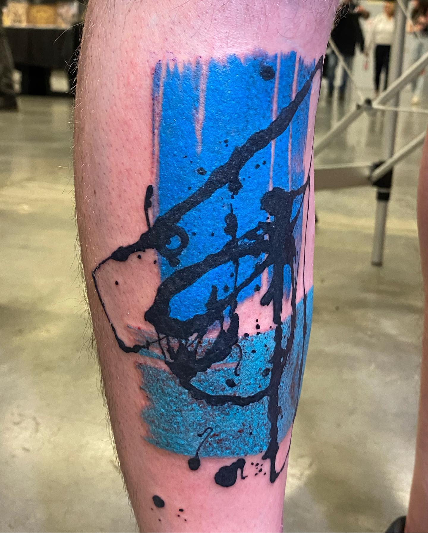 Abstract splatter dotwork tattoo on the forearm by Keith Cromie