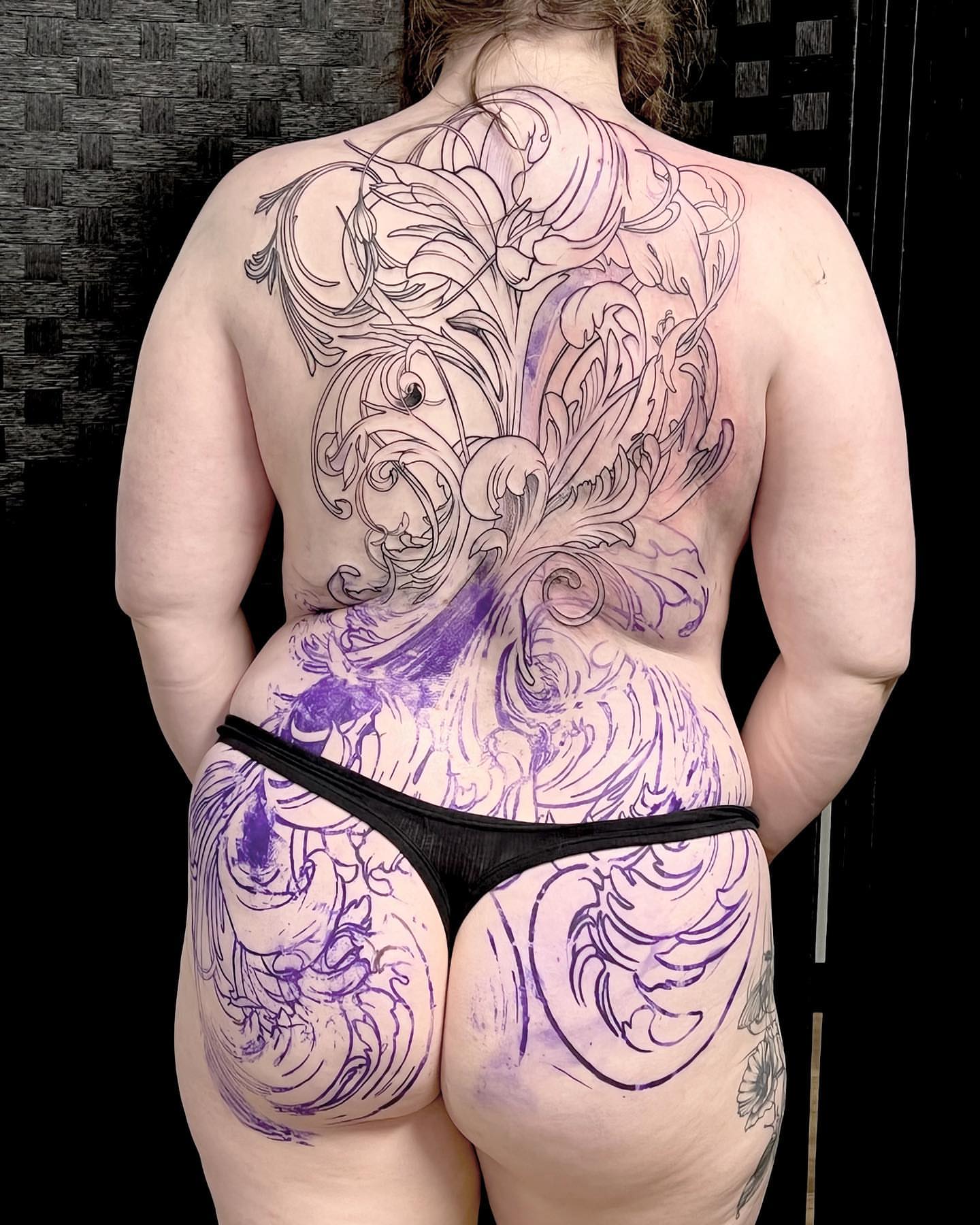 Floral design ornamental tattoo on the back by Emily Jestine Francis