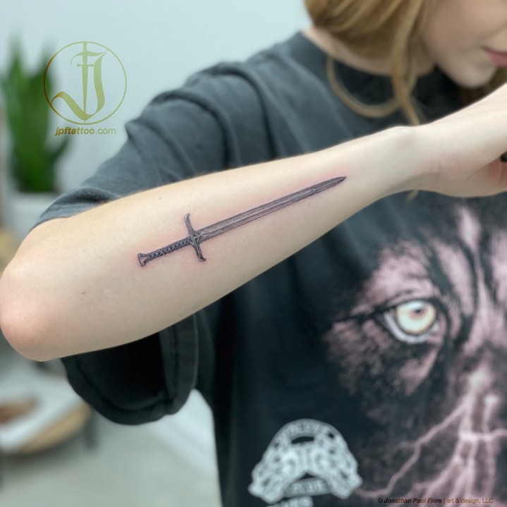 Sword black and grey tattoo on the forearm by Jonathan Paul Fiore, Austin, Texas