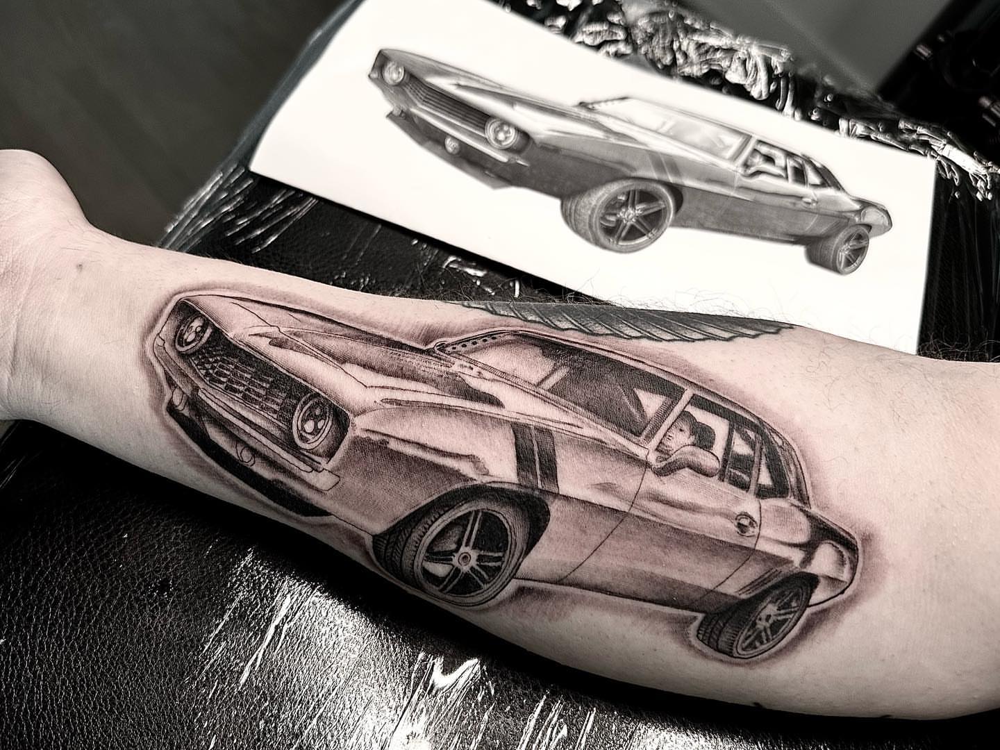 Muscle car realism tattoo on the forearm by Matthew Clanin