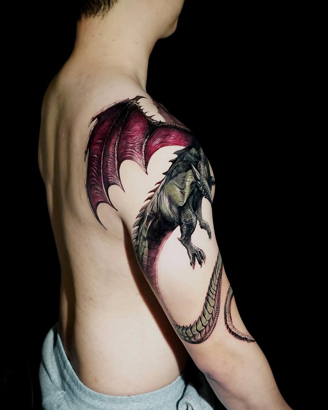Dragon watercolor tattoo on the shoulder by Eun, Toronto, Ontario