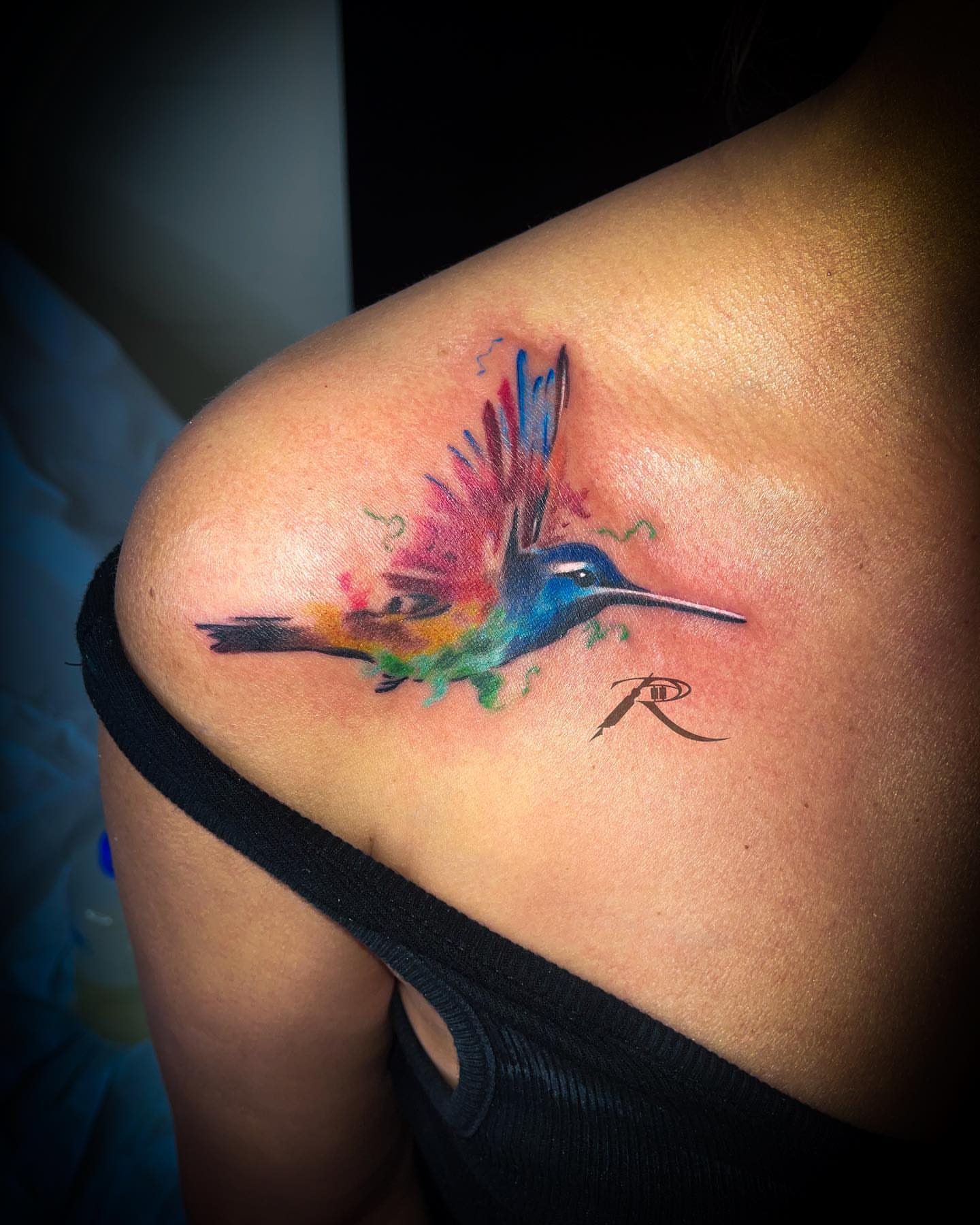 Hummingbird watercolor tattoo on the shoulder by Ride The Needle Tattoos, New Britain, Connecticut