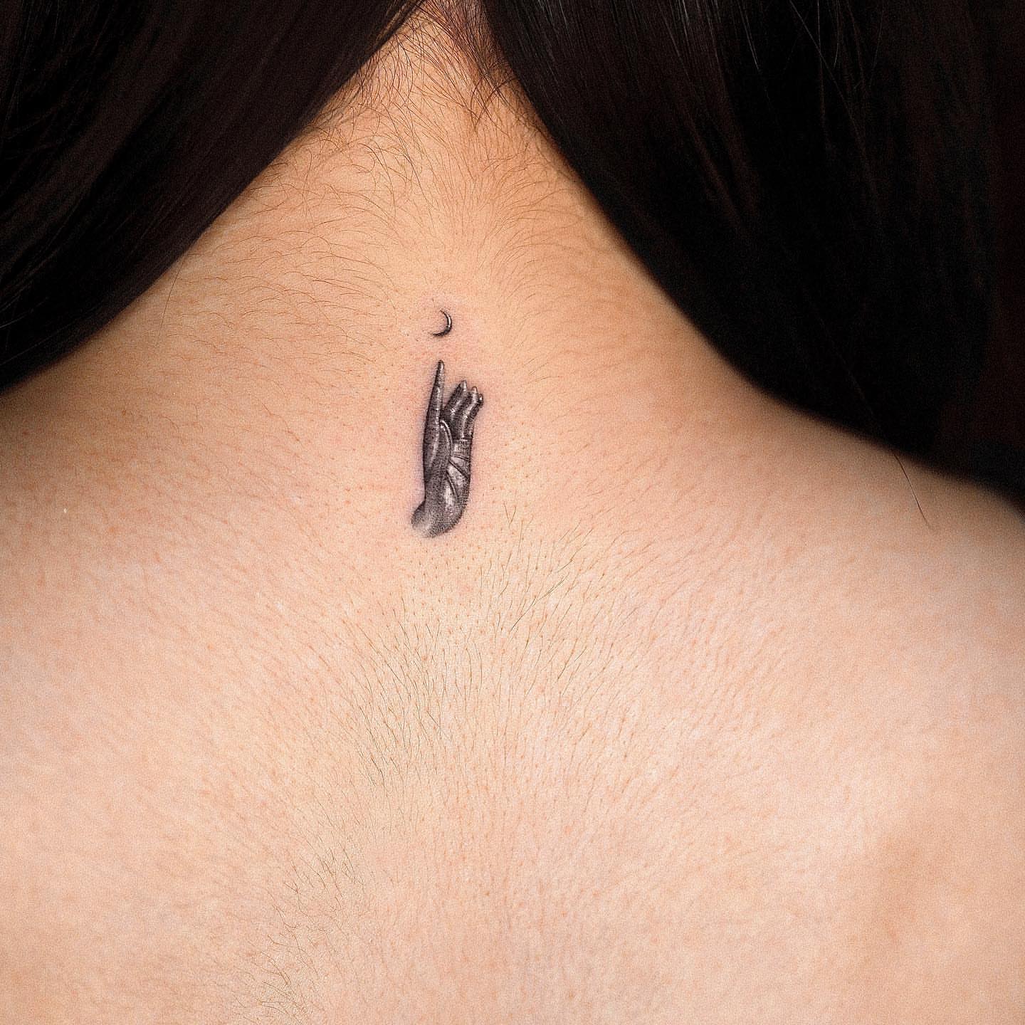 Hand reaching towards moon black and grey tattoo on the neck by Rizn