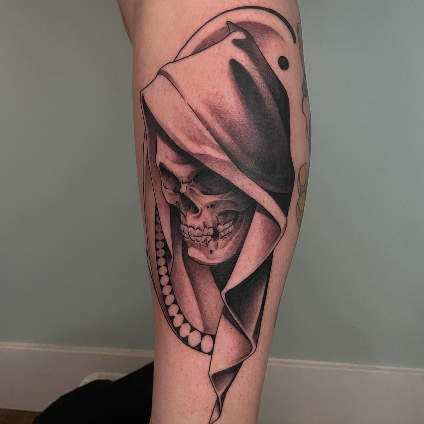 Skull wearing hood realism tattoo on the forearm by Angel, Salt Lake City, Utah
