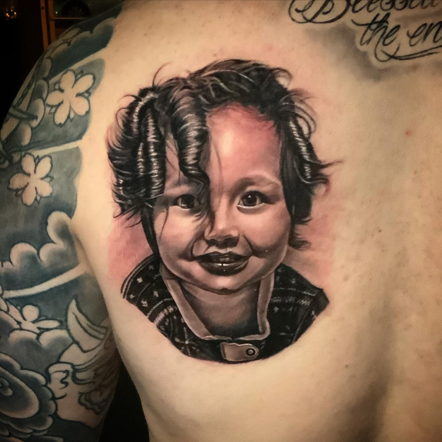 Child portrait realism tattoo on the shoulder by Christian Medina, Sacramento, California