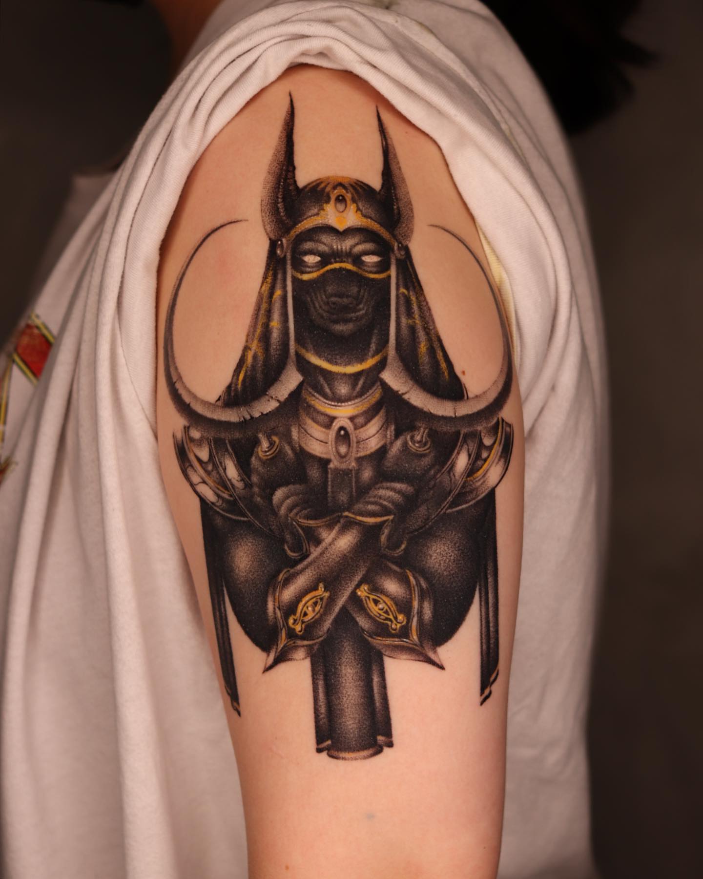 Anubis black and grey tattoo on the shoulder by Yujhi