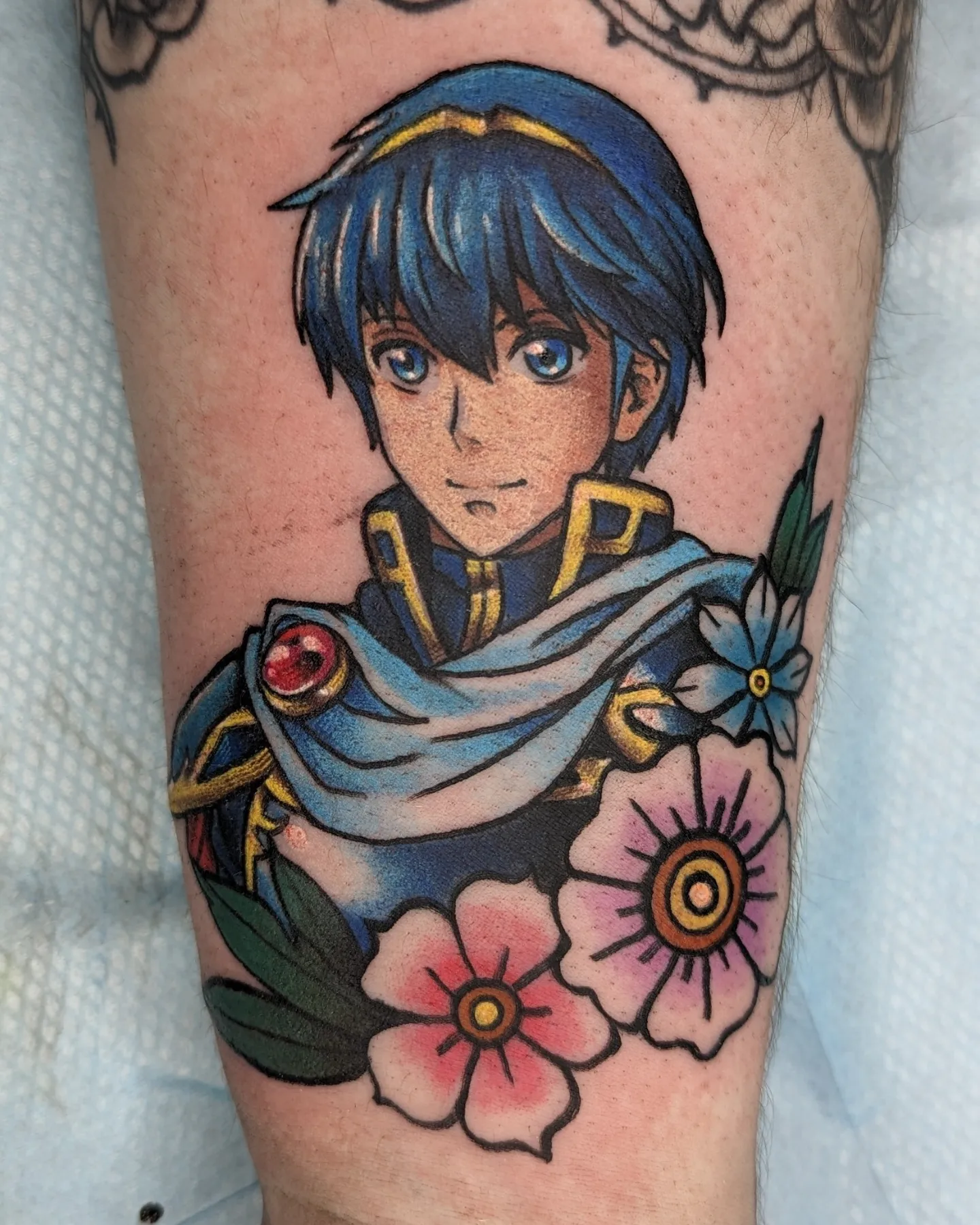 Anime character with flowers anime tattoo on the forearm by Harley Fulghum