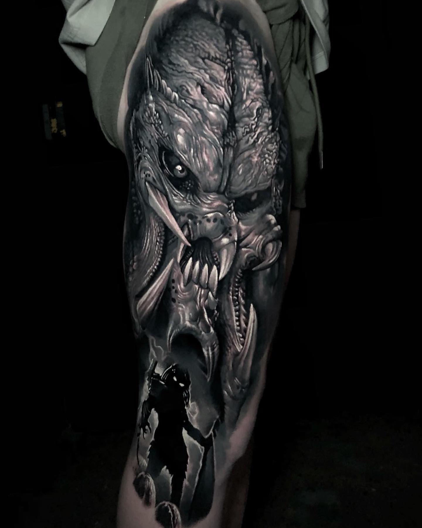 Monster dark realism tattoo on the leg by Anton Martiushev